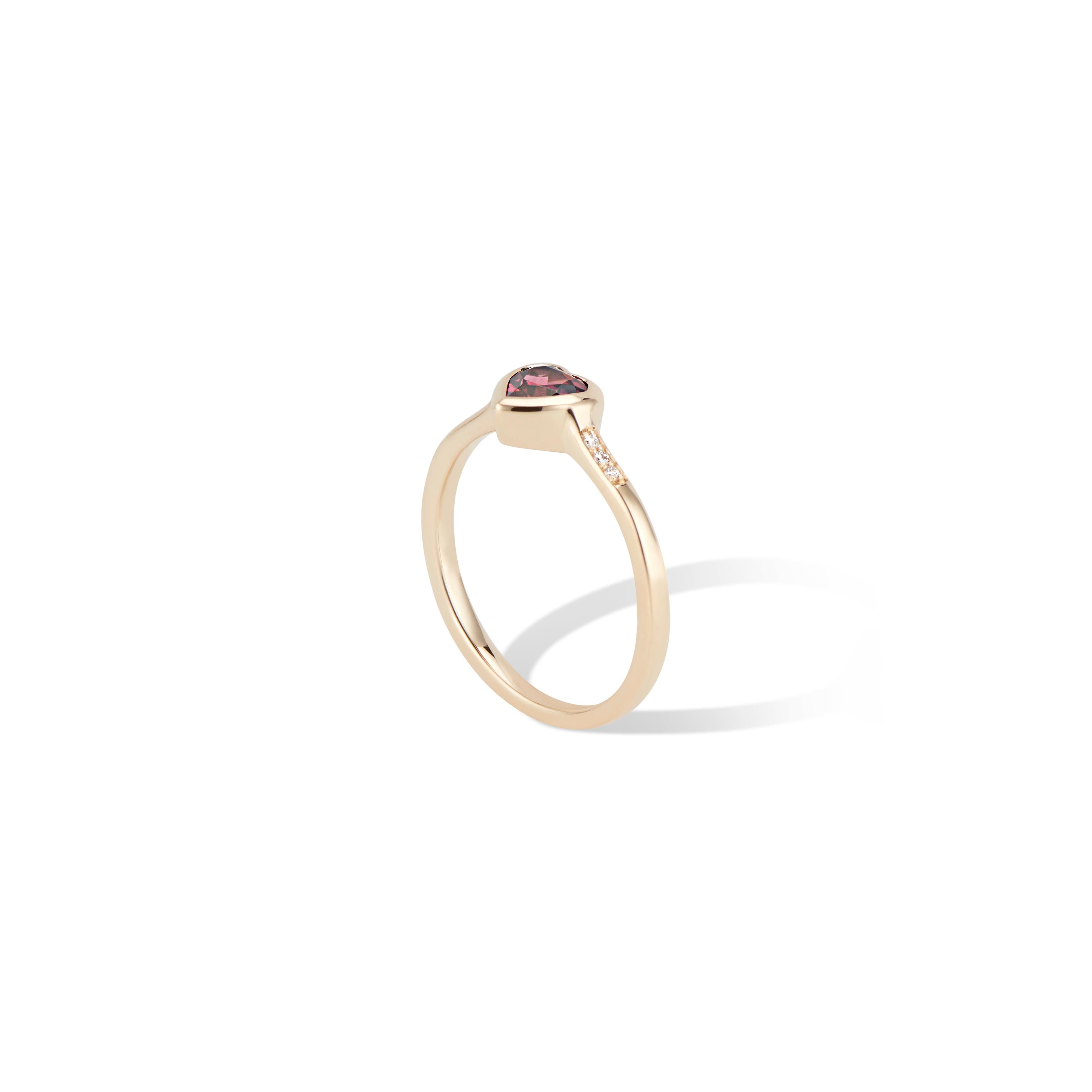 This 14K Yellow Gold Diamond and Rhodolite Heart Ring is a petite stacking ring. 
Layer with more hearts, bezel set gems or stacking bands.

Featuring a striking ½ carat (.50tcw) Rhodolite Garnet Heart and in a polished bezel setting, with 
a little