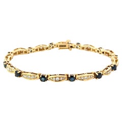 Bracciale tennis con diamanti e zaffiri in oro giallo 14k