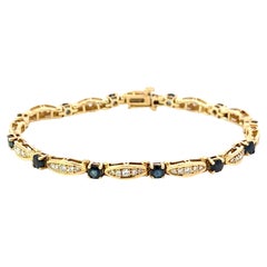 Bracelet tennis en or jaune 14 carats avec diamants et saphirs