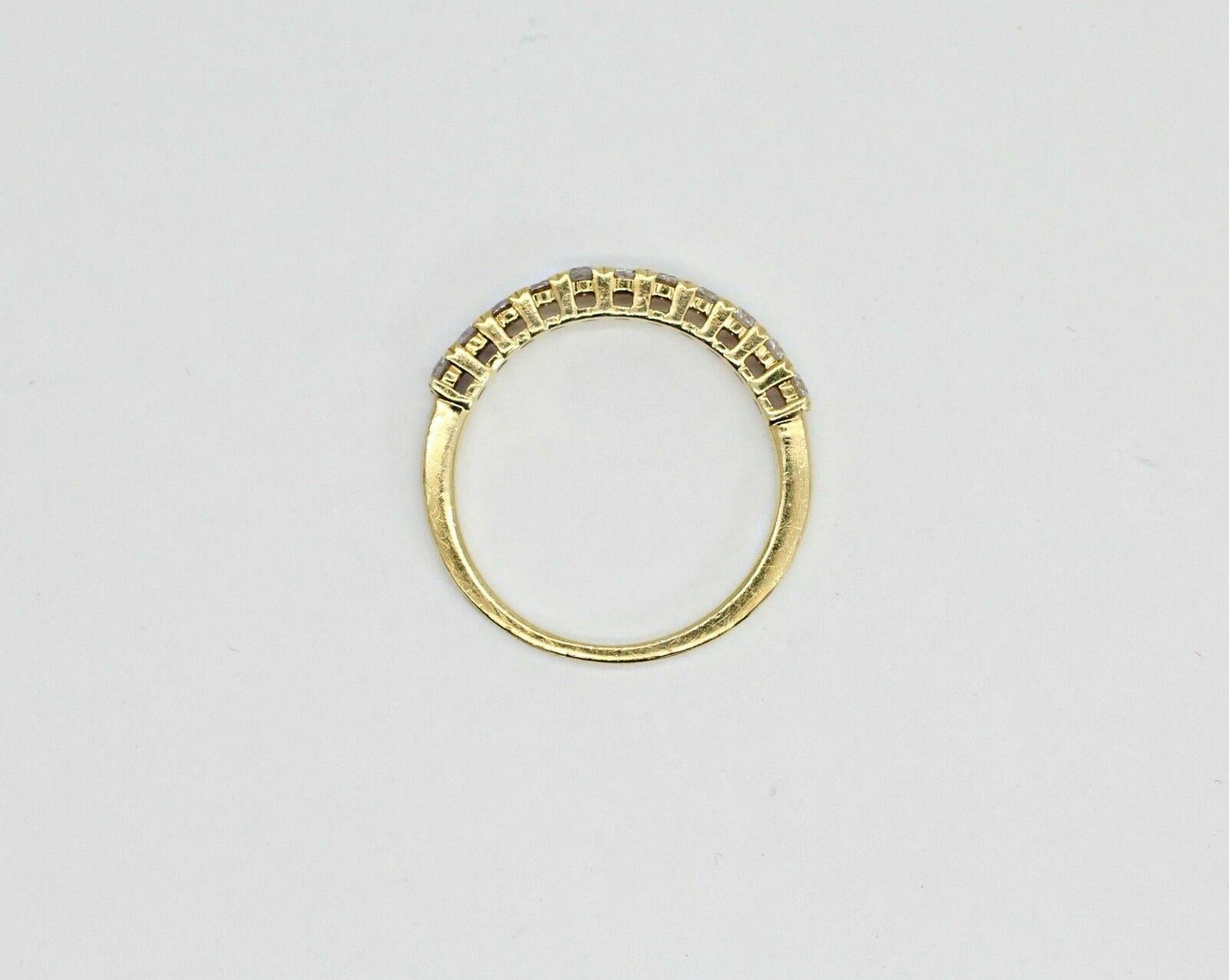 A vintage diamond band in solid 14k yellow gold, with 11 round diamonds, approximately 0.44 carat total weight. it's current ring size is 7US but I can get it resized for free. 
Diamonds
Shape:     Round
Carat Total Weight:    0.44ctw
Color:      G