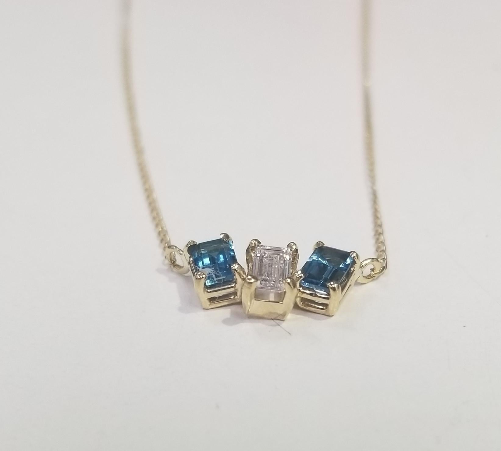 Contemporary 14 Karat Yellow Gold Diamond Baguette and Blue Topaz Pendant For Sale