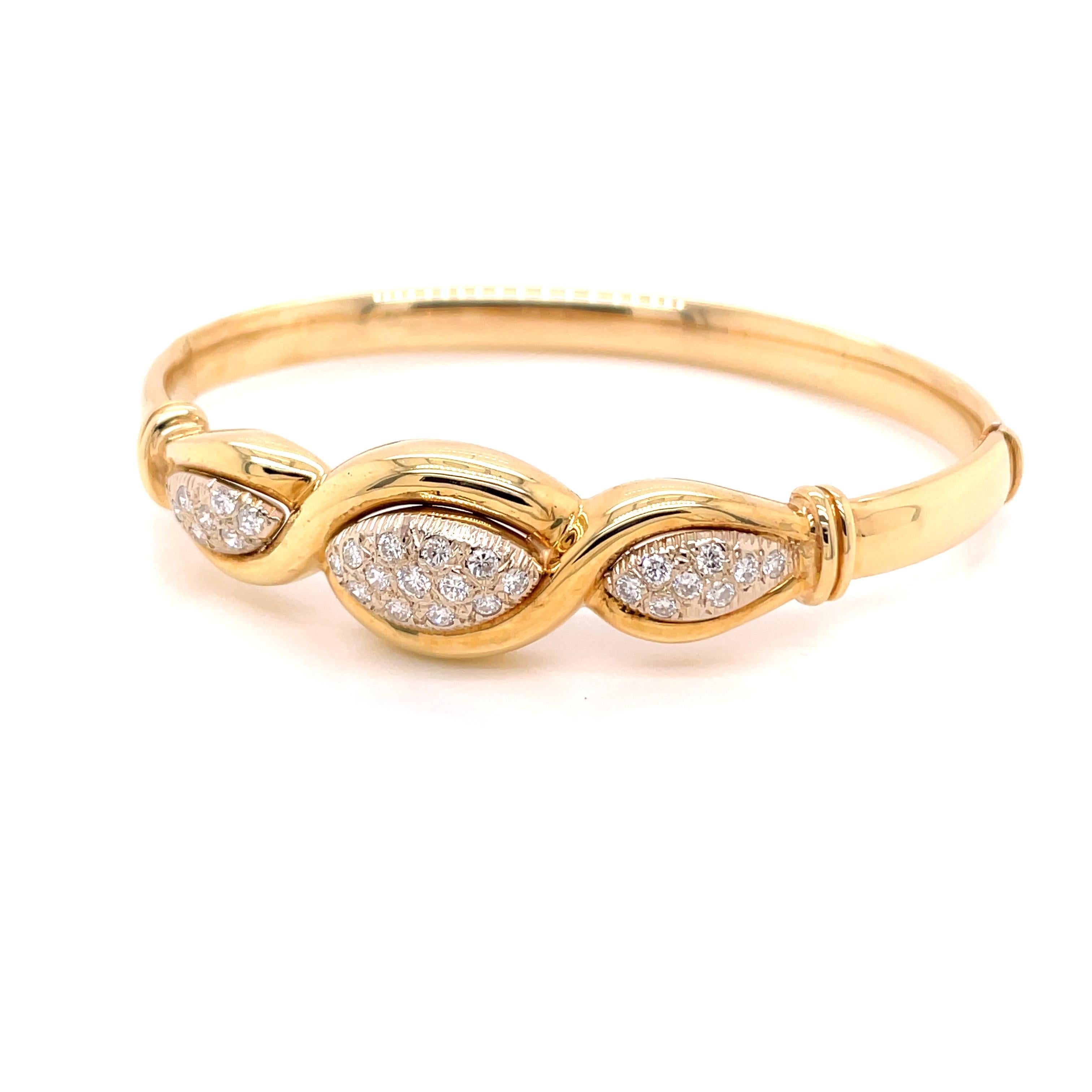 14K Yellow Gold Diamond Bangle Bracelet .82ct - The bangle contains 29 round brilliant diamonds pave set in 3 sections with a total approximate weight of .82ct. The diamonds are G - H color and VS2 - SI1 clarity. The bangle measures 14.4mm wide on