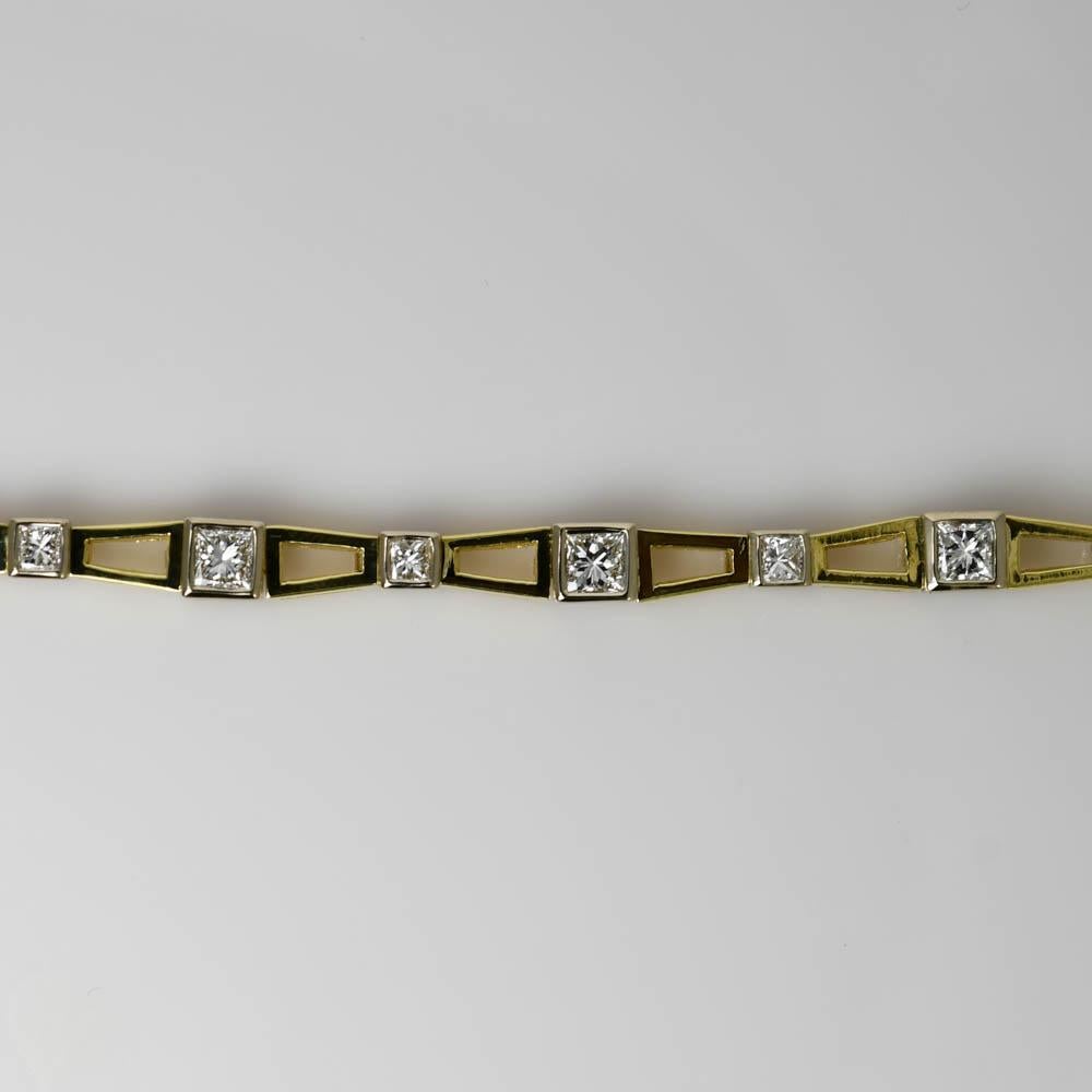 Ladies diamond bracelet in 18k yellow gold.
Stamped 18k and weighs 22.5 grams.
There are 7 - .45ct princess cut diamonds and 7 -.15 carat princess cuts, 4.20 total carats, H to i color, VS clarity.
The bracelet measures 6 3/4 inches long and 5.30mm