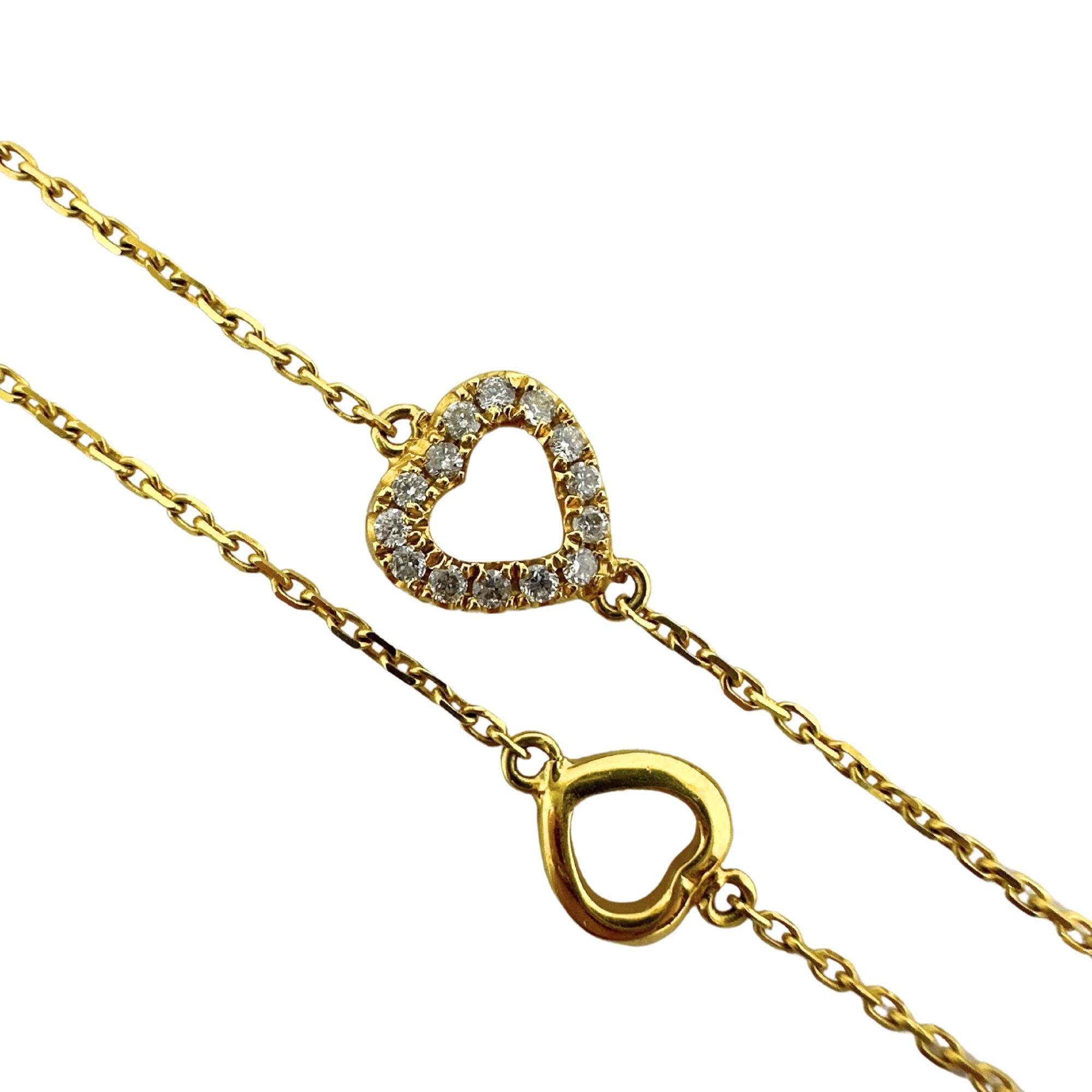Diese elegante Herz-Halskette aus 14-karätigem Gelbgold ist mit zarten Diamanten von insgesamt 0,47 Karat besetzt, die in eine zeitlose 23-Zoll-Kette eingefasst sind. Sie ist in gutem Zustand mit geringfügigen Abnutzungserscheinungen an der