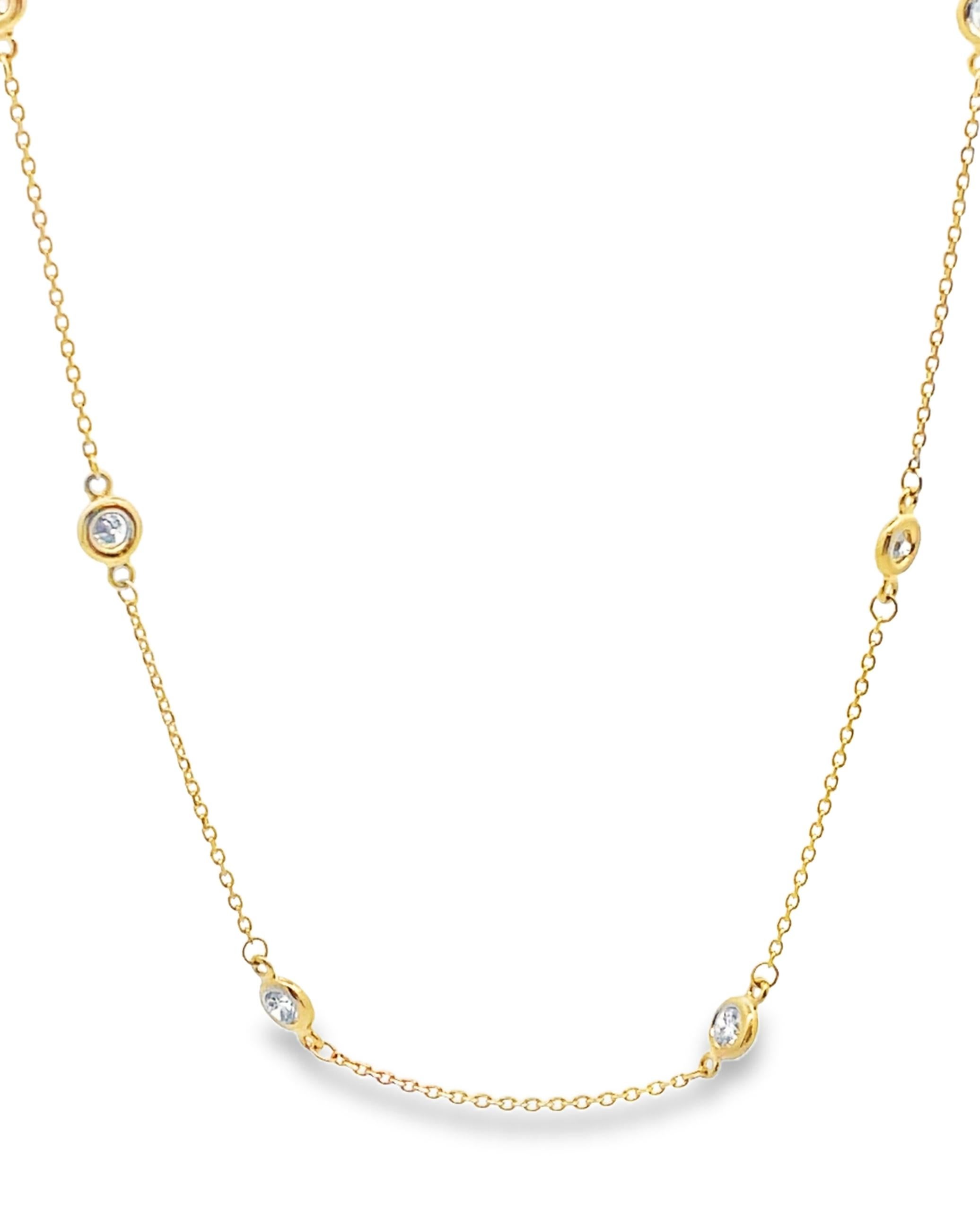 Collier en or jaune 14K avec 12 diamants sertis en chaton pesant 1,05 carats au total.  

- Collier de 18 pouces de long 