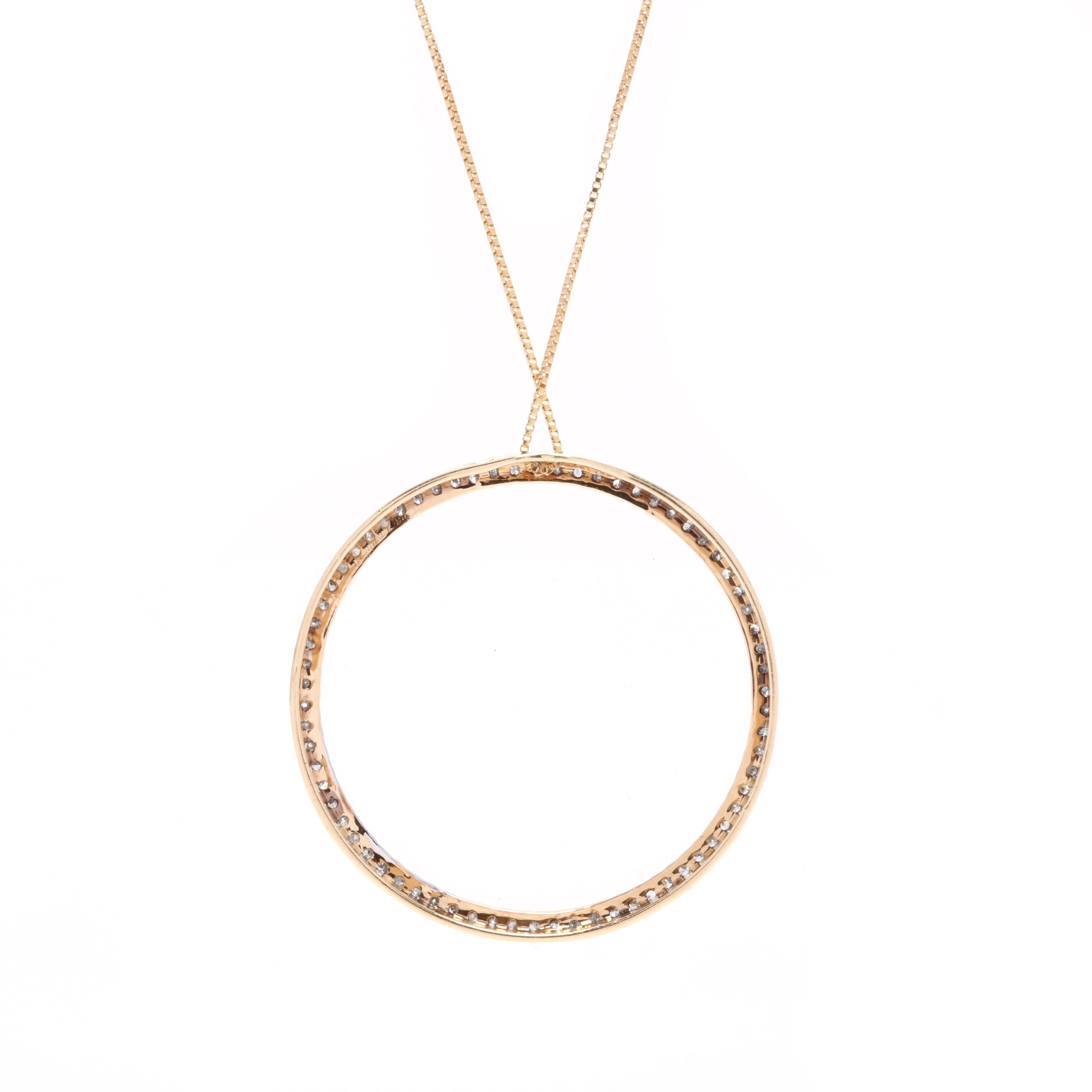 A classic diamond circle pendant set with 70 round, single cut diamonds in 14k yellow gold. The diamonds are 1.1 mm each coming to an approximate 0.50 carat total weight. They are J-L in color and I2-I3 in clarity. The pendant comes on a dainty box