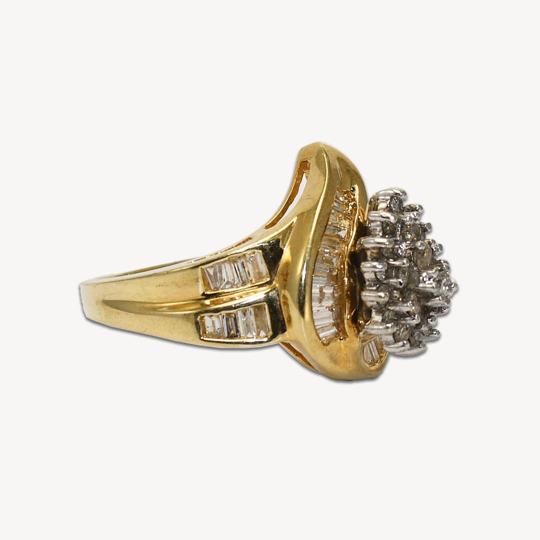 Diamond Cluster Ring in 14K Yellow Gold.
Diamond color grade: K.
Diamond clarity: I.
Ring size: 7.
Weight: 6.5 grams.