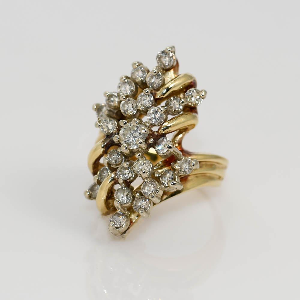 14K Diamond Cluster Ring, with 1.00tdw.
Clarity and Color Ranges from SI2-I1, G-H-I.
The center stone is .20ct. 
Clarity I1-Color G-H
Weighs 9.4gr, Size 6.
Can be sized up or down for additional fee.
