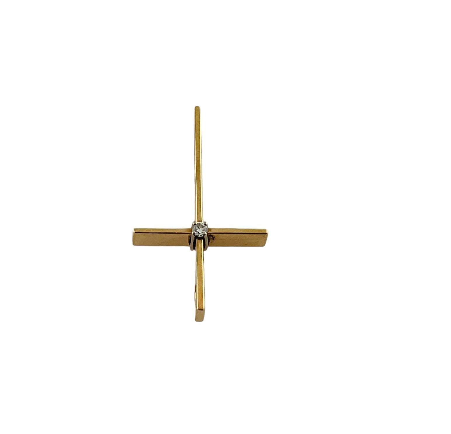 14K Yellow Gold Diamond Cross Pendant

This cross pendant is set in 14K yellow gold with a single round brilliant diamond in its center

Diamond is approx. .03 cts and of VS2 clarity and G color

Pendant  measures approx. 1 1/4