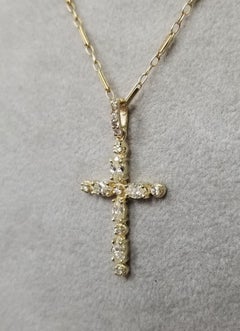 14 Karat Yellow Gold Diamond Cross Total Weight .86pts