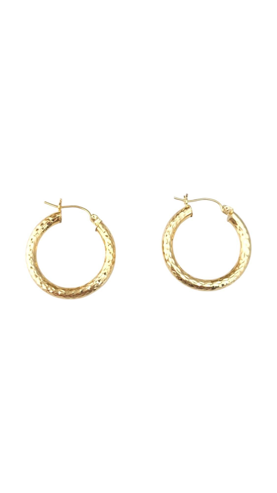 14K Yellow Gold Diamond Cut Hoop Earrings -

These regular hoop earrings showcase a classic, streamlined design that never goes out of style. Lightweight and versatile, they effortlessly complement any outfit—from casual to formal—making them an