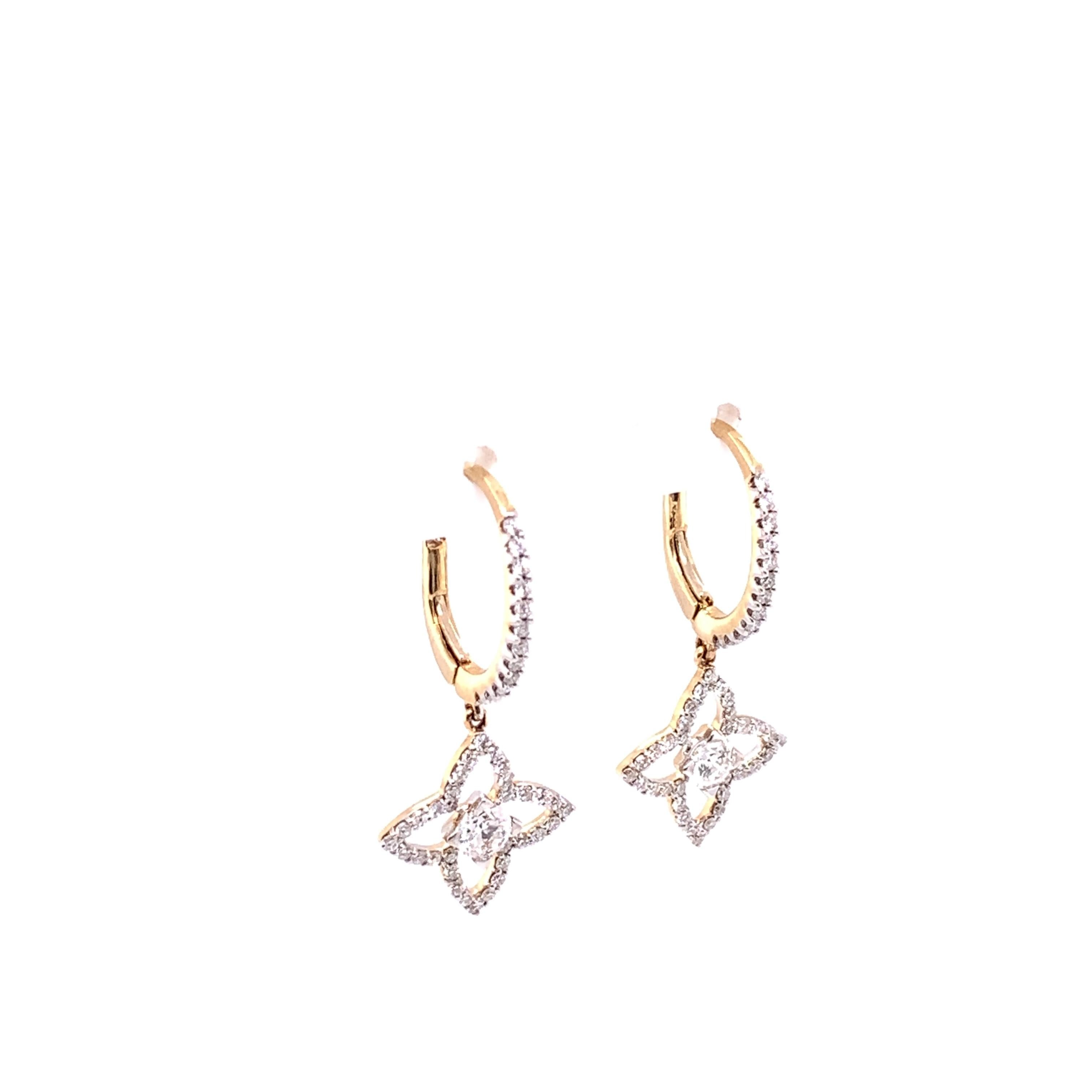 These brilliant lever back dangle earrings crafted in 14 karat yellow gold features a total of 3/4 carat weight round brilliant diamonds. Theses earrings are designed in a classy clover style with a beautiful round brilliant diamond in the center.