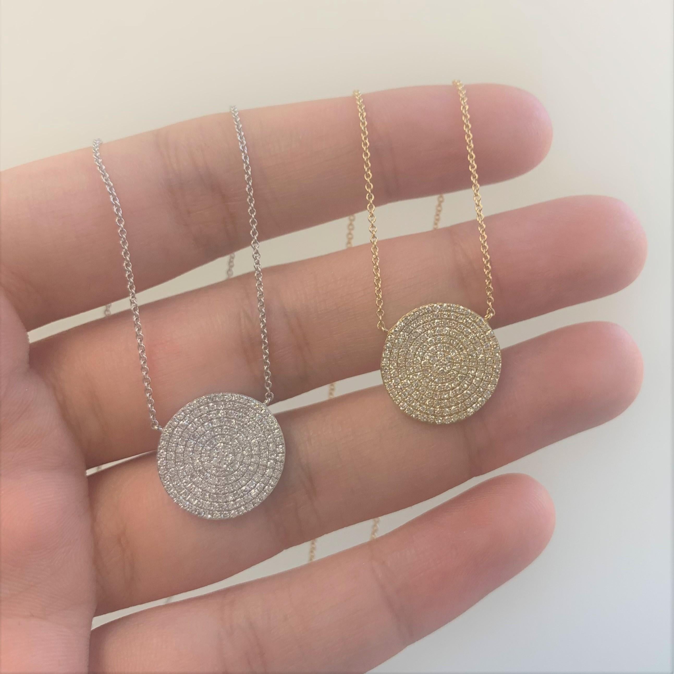 Adorn yourself with this classic and elegant disc necklace, Crafted of 14k gold and featuring approximately 0.58 ct. of sparkling white diamonds. Available in white, yellow and rose gold.  Diamond color and Clarity GH SI1-SI2. Lobster Clasp