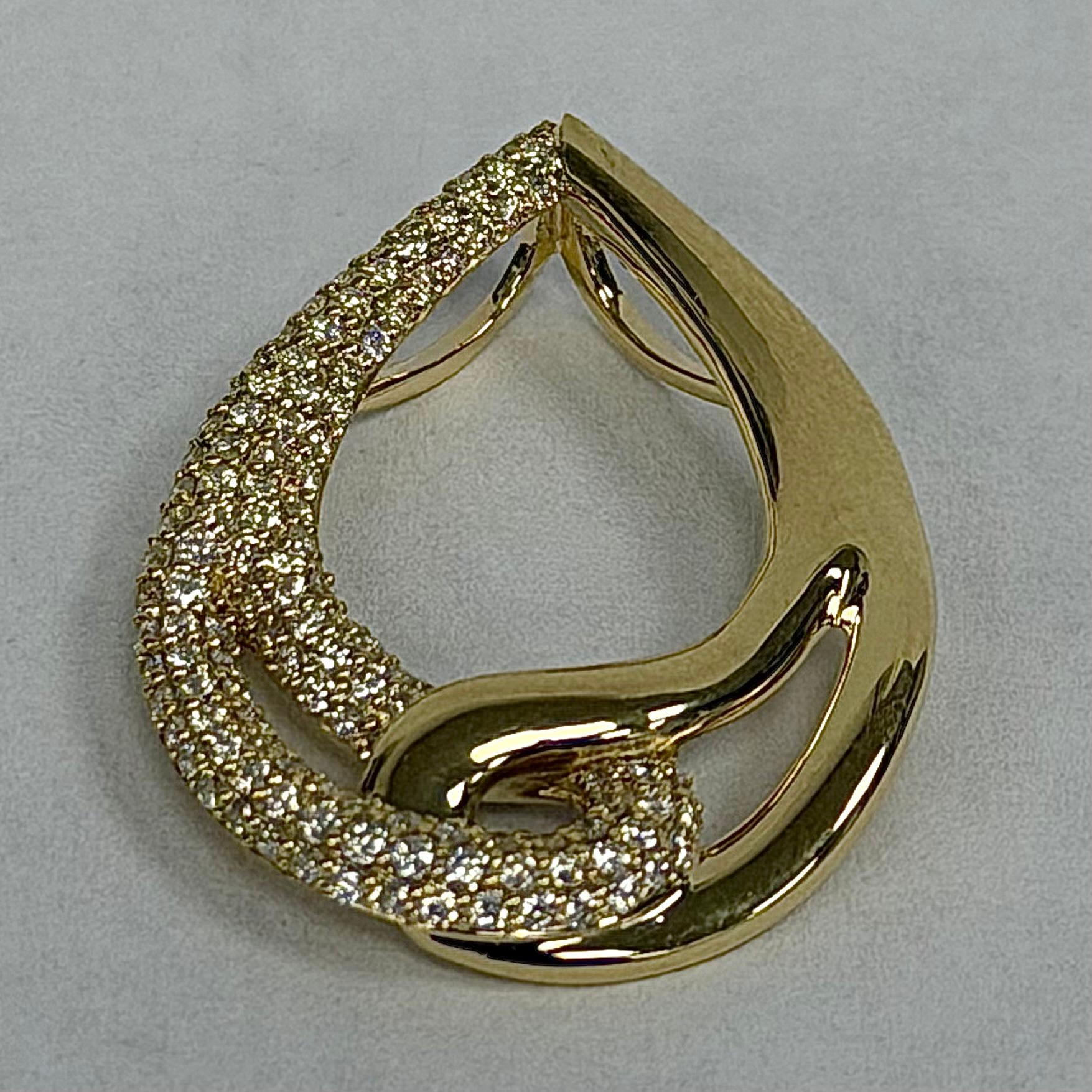 This 14K Yellow Gold Diamond Drop Pendant is a bright and stylish piece that adds gentle sparkle to any outfit. Made from 2.3 grams of solid yellow gold, it feels sturdy yet comfortable to wear. The pendant is set with 121 round diamonds totaling