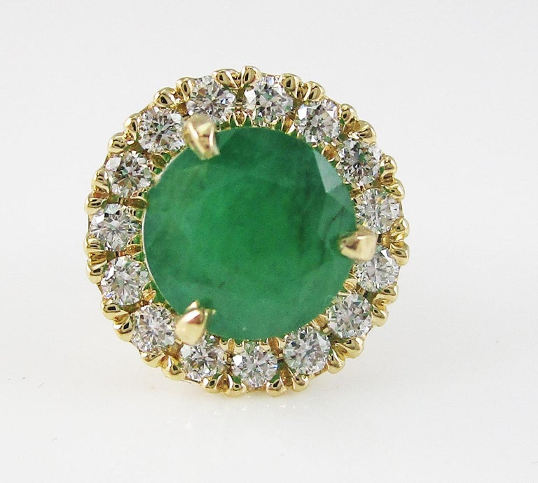 These are a lovely pair of stud earrings featuring emerald centers and delicate diamond halos! The combination of bright yellow gold, white diamonds, and rich green emeralds makes for a timelessly elegant earring. The simple low-base stud layout