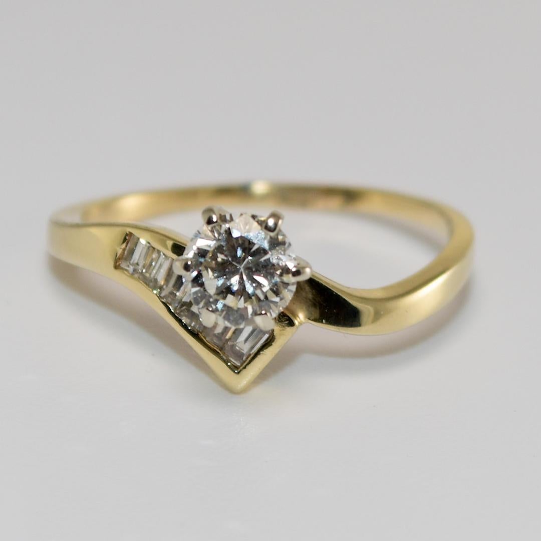 14k yellow gold diamond engagement ring and band set
The engagement ring is a 0.50 carat round brilliant solitaire ring
The diamond has SI1 clarity with a J - K color
The engagement ring and band accent the center stone with 0.50 total carats of
