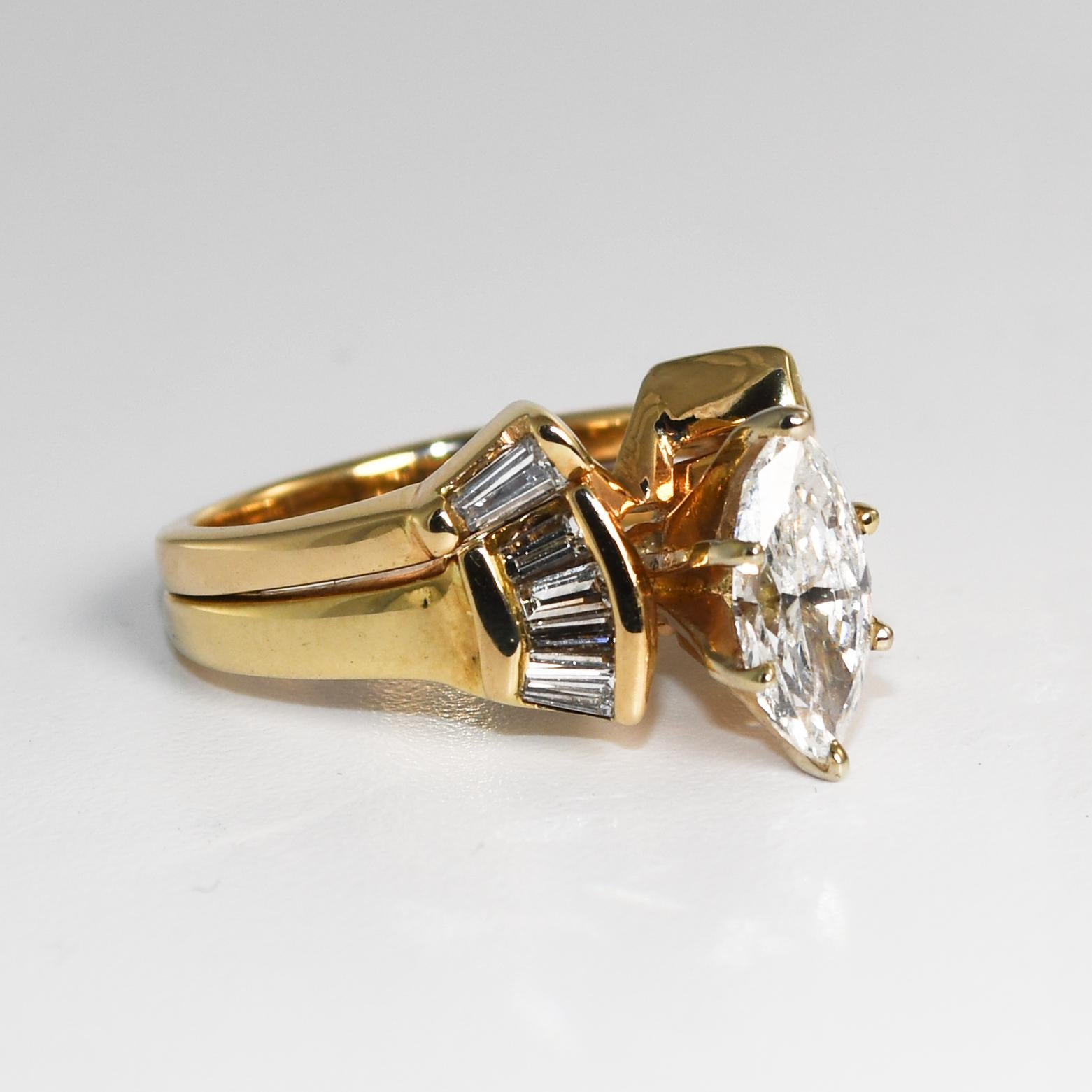 This is a 14k yellow gold accented solitaire engagement set.
The engagement ring features an EGL-certified 1.01 carat 10.14 x 4.13 x 3.30mm marquise brilliant diamond.
SI2 clarity and F color.
This diamond has been fracture-filled. Good Cut.
There