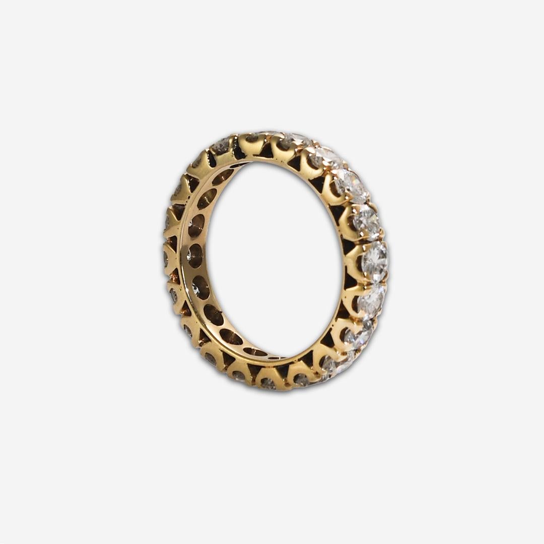 Diamond eternity ring in 14k yellow gold setting.
The setting tests 14k with an electronic tester.
The gross weight is 4 grams.
The diamonds are round brilliant cuts, 20 x .17 carats, approximately 3.40 total carat weight.
The color range is G, H,