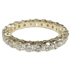 14K Yellow Gold Diamond Eternity Ring with 2.58cts. Set with Shared Prong