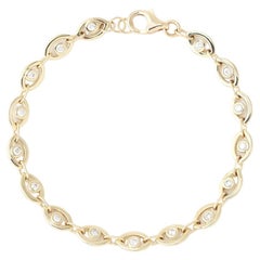 Bracelet tennis oeil en or jaune 14 carats et diamants