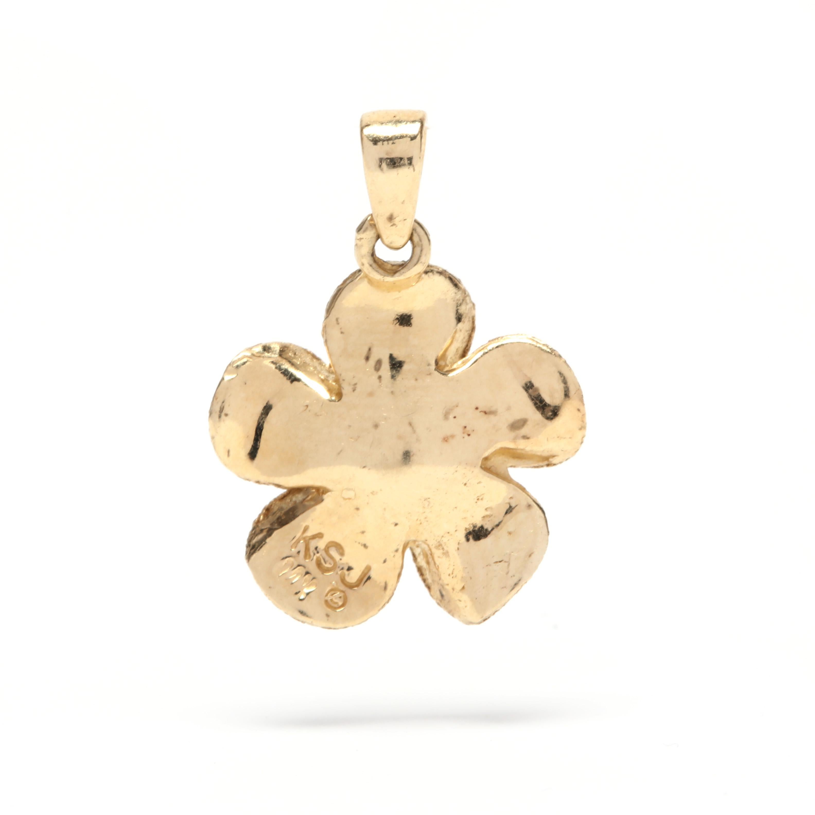 A 14 karat yellow gold and diamond flower charm / pendant. A five petal flower motif with a central, prong set full cut round diamond weighing approximately .11 carat and with a textured finish.

Stone:
- diamond
- full cut round, 1 stone
- 3 mm
-