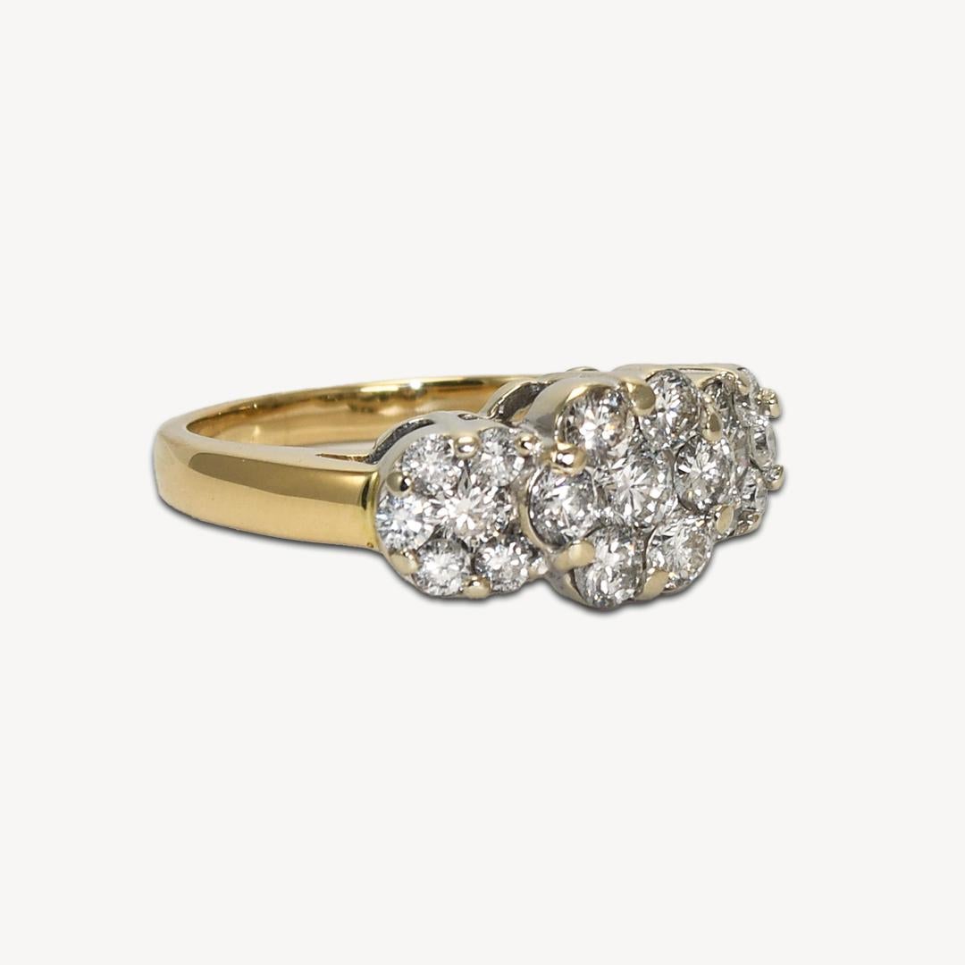 Diamond cluster ring in 14k yellow gold.
Stamped 14k and weighs 5.3 grams.
The diamonds are round brilliant cuts, 1.00 total carats, H to I color, SI1-SI2 clarity, and good cuts.
The ring measures 8.5mm wide at the top.
The ring size is 7 1/4 and