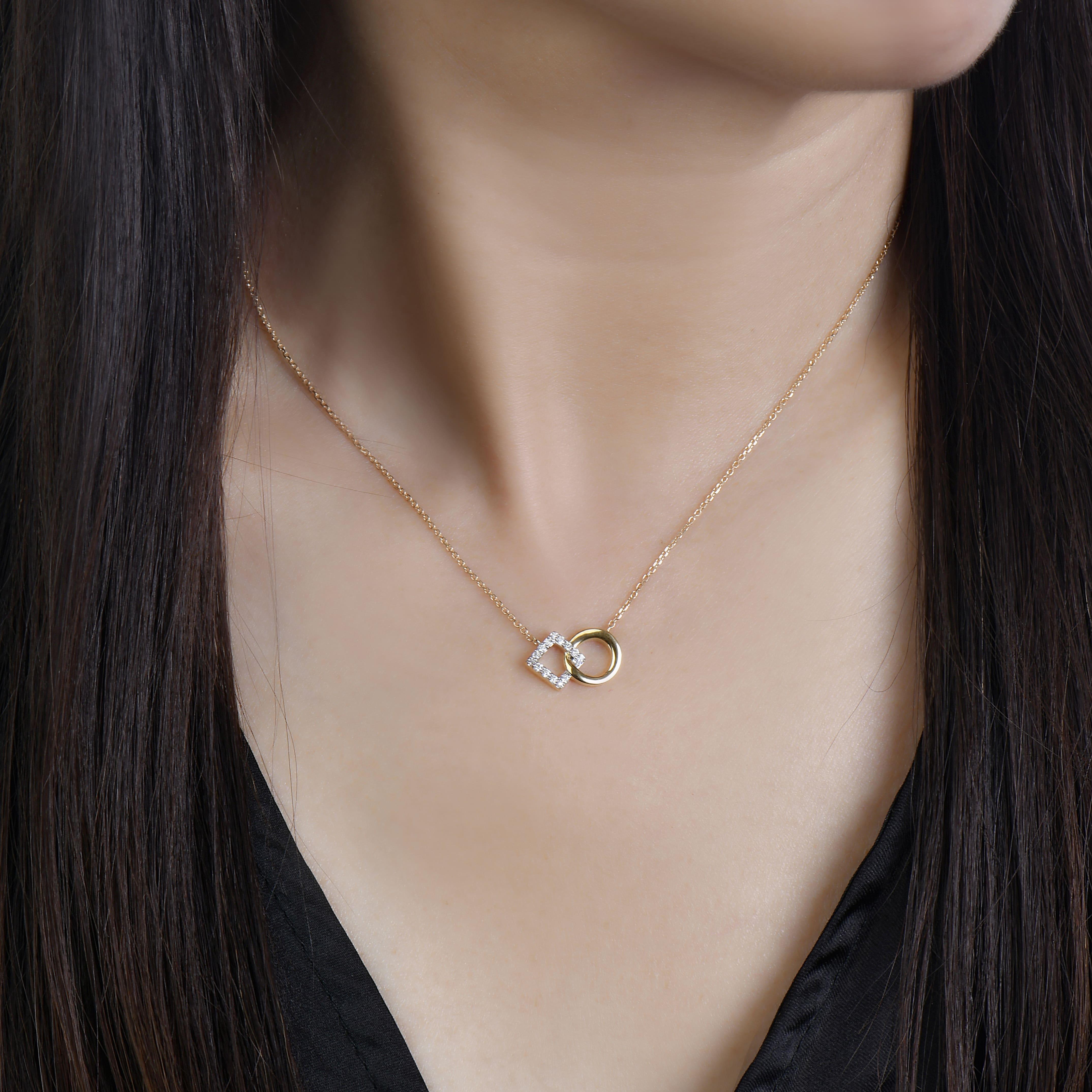 This geometric diamond necklace embodies femininity. A classy and chic design, the 14k gold necklace embodies the connection between two people. This romantic piece is the perfect layering necklace yet it's chic enough to wear as a standout. 

14K