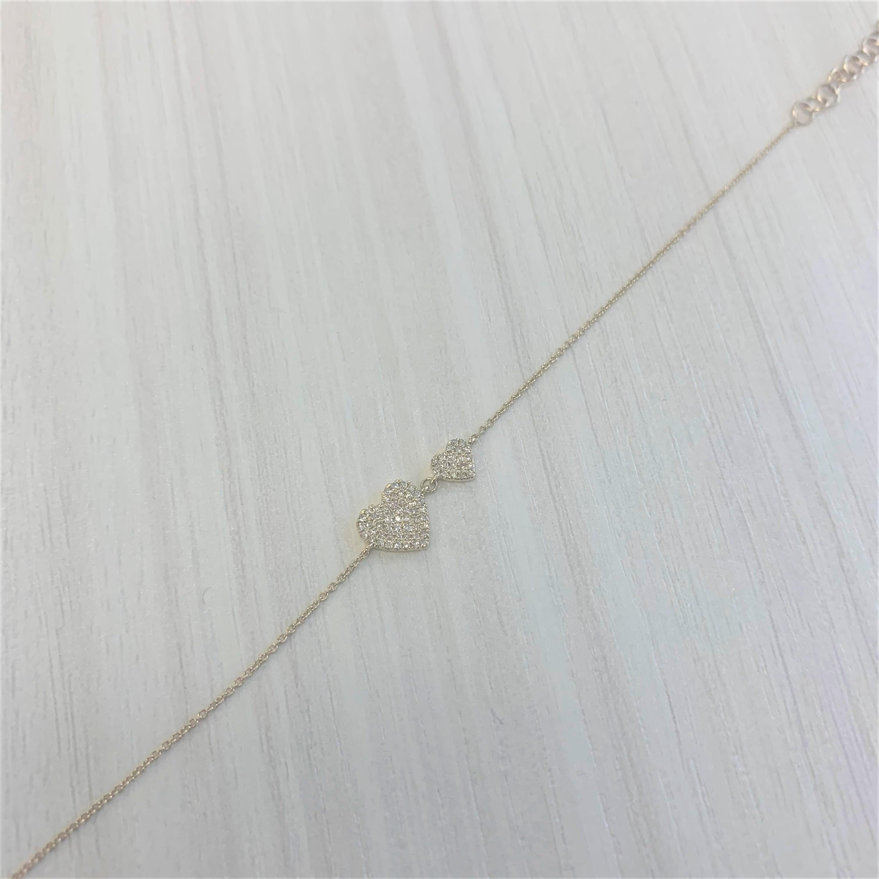 Heart Pave Chain Design Bracelet: This beautiful and eye-catching Heart Bracelet is made of 14K Gold and features 0.21 carats of natural round white Diamonds; the bracelet length is adjustable from 6.75