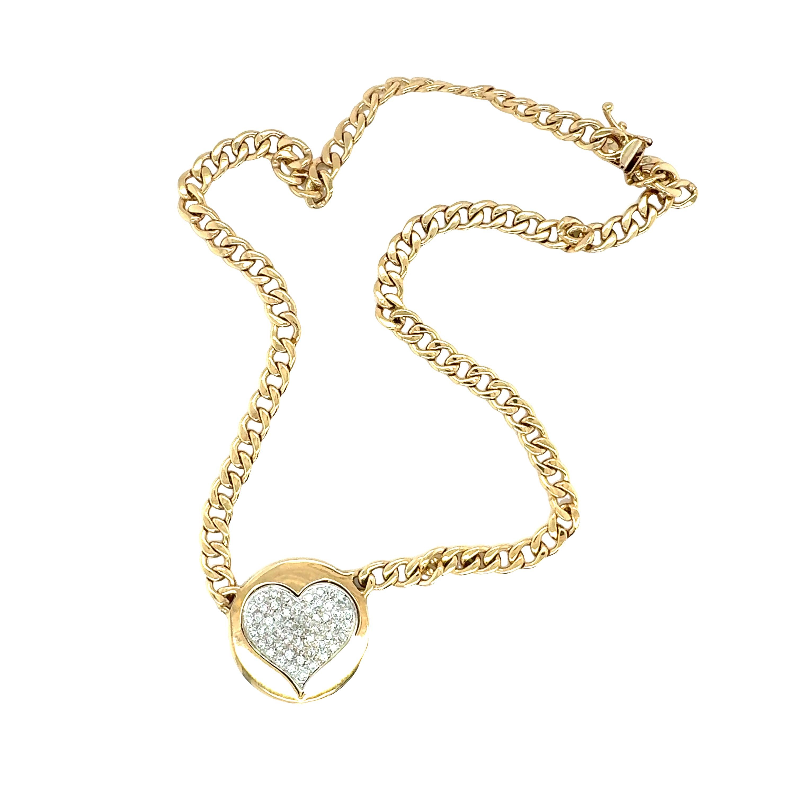 One circular diamond heart pendant in 14K yellow gold featuring 52 pave set, round brilliant cut diamonds totaling 0.81 ct. with J-K color and SI-1, SI-2 clarity. Attached to an open curb link chain necklace. Measures 25 millimeters in diameter at