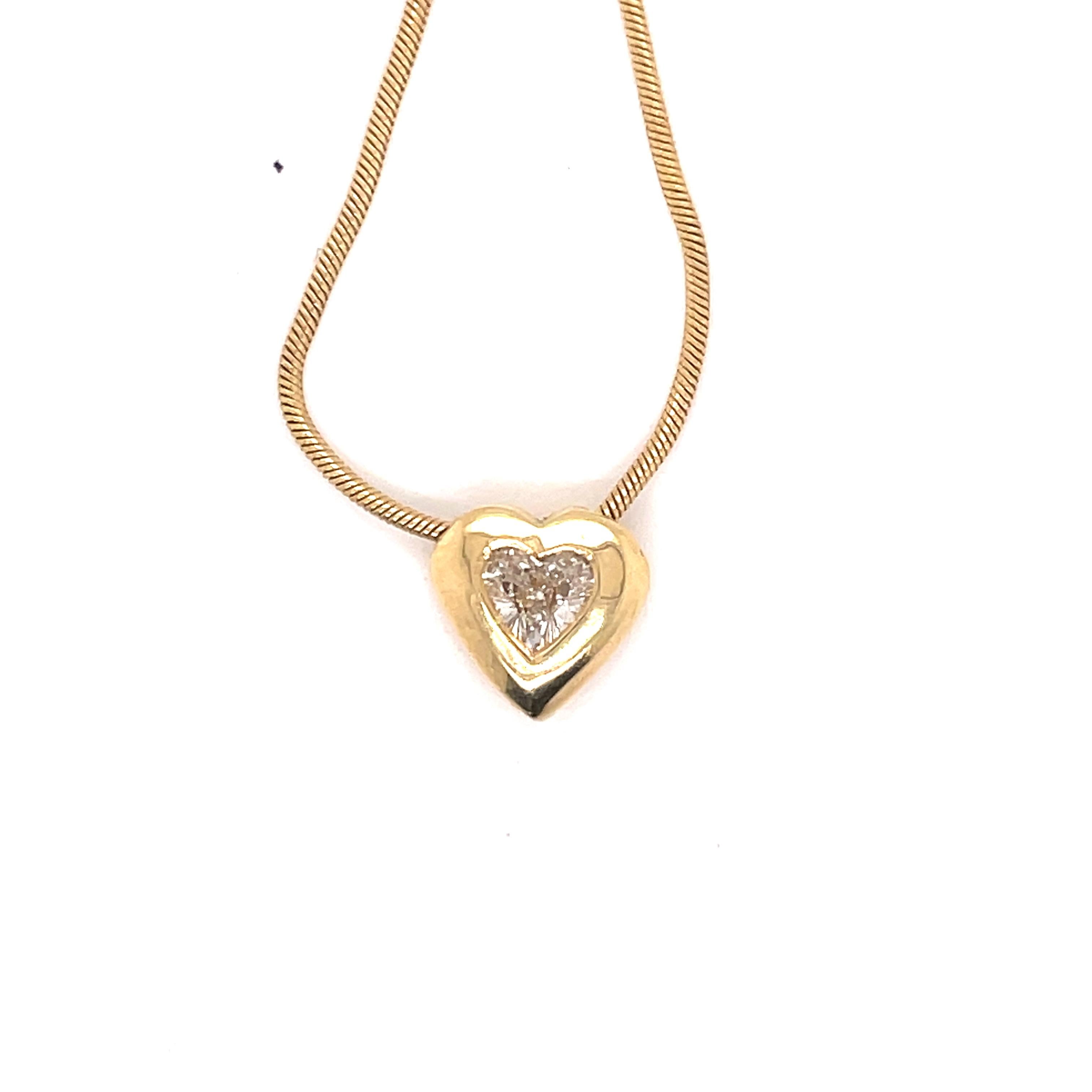 A bezel set 14K Yellow Gold Diamond Heart Pendant. Diamond weight ~ .30 carat