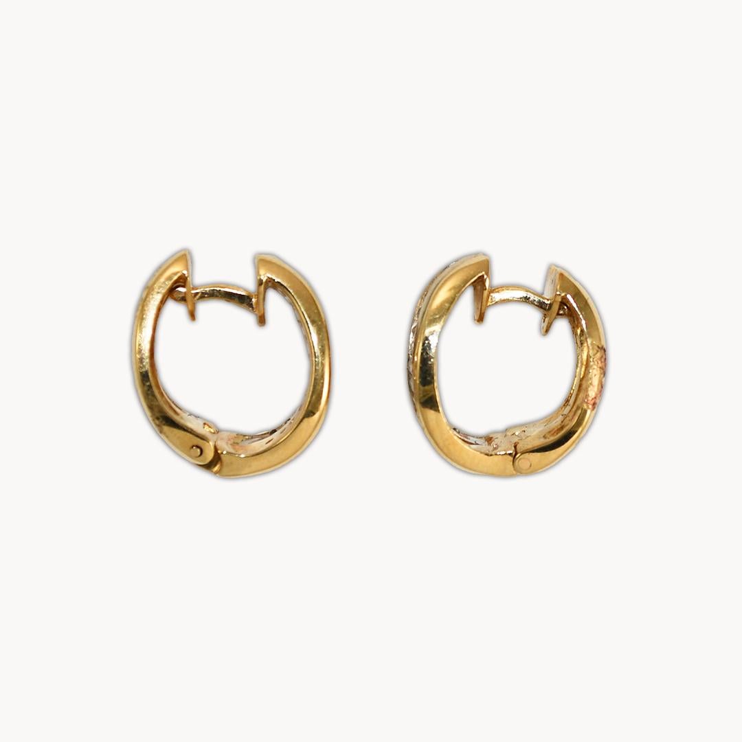 Diamond earrings in 14k yellow gold.
Stamped 14k and weighs 9.3 grams.
The diamonds are round brilliant cuts in a channel setting.
The color is G, clarity Si, and .50 total carats.
The earrings measure 7mm wide and 15mm in diameter.
There are posts