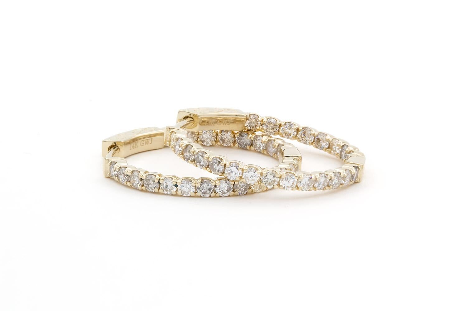 We are pleased to offer these Brand New Unworn 14k Yellow Gold & Diamond Inside-Outside 1 Inch Hoop Earrings. These stunning earrings are fun and vibrant! They feature 1.54ctw G-H/VS-SI round brilliant cut diamonds set in 14k yellow gold 1 inch