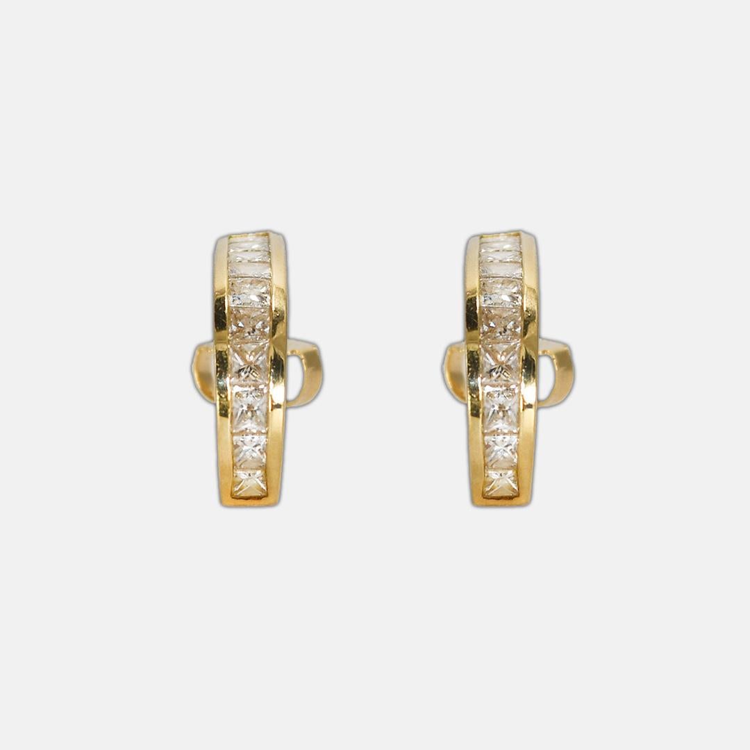 14k yellow gold J curve earrings.
Test 14k and weigh 3.5 grams.
There are 10 Princess cut Diamonds in each earring,  1.50 total carats, H-i-j color range, Vs to Si clarity.
The earrings measure 1/2 inch long. 
There are posts with friction backs for
