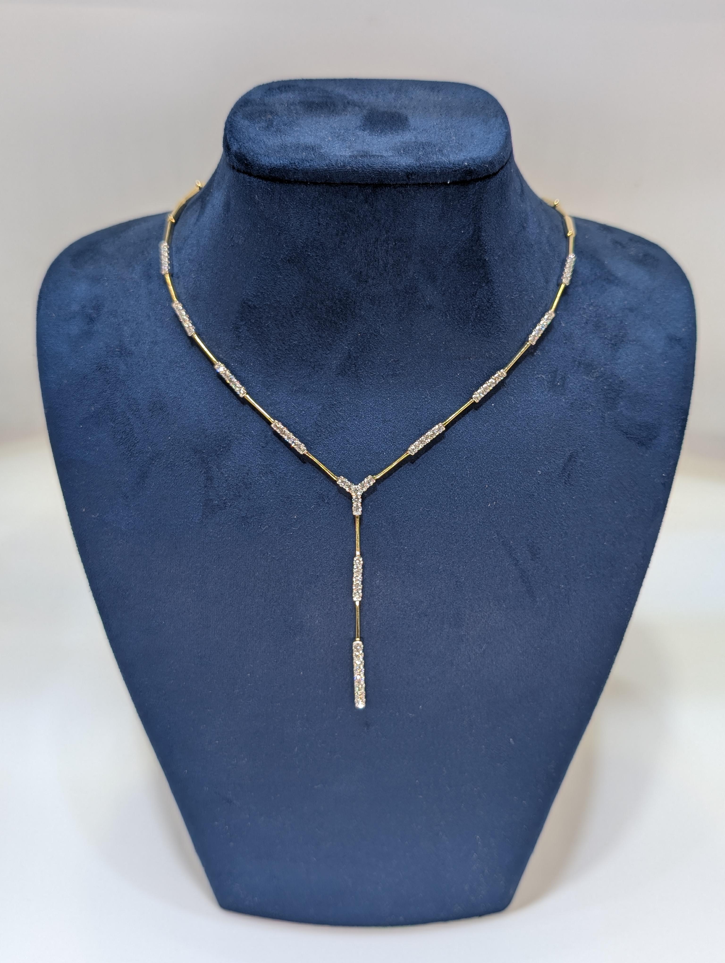 This is an absolute beauty. Set on a 14K gold bar necklace which showcases 60 round natural diamonds. This piece will impress her friends and make you look awesome! Guys, this is the one for your lady! This just came in and it will sell fast! I will