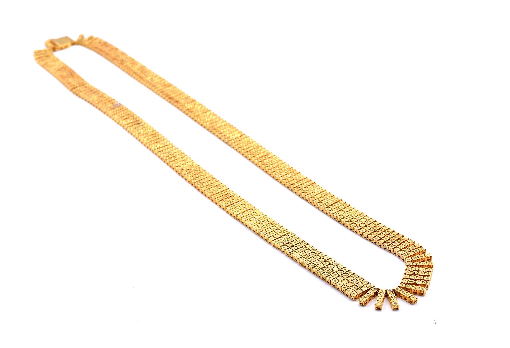 Designer: custom designed
Material: 14k yellow gold
Diamonds: 850 round brilliant cut= 1.80cttw
Color: I
Clarity: I1
Dimensions: necklace is 28 ½-inches long and it is 12.80mm wide
Weight: 48.95 grams
