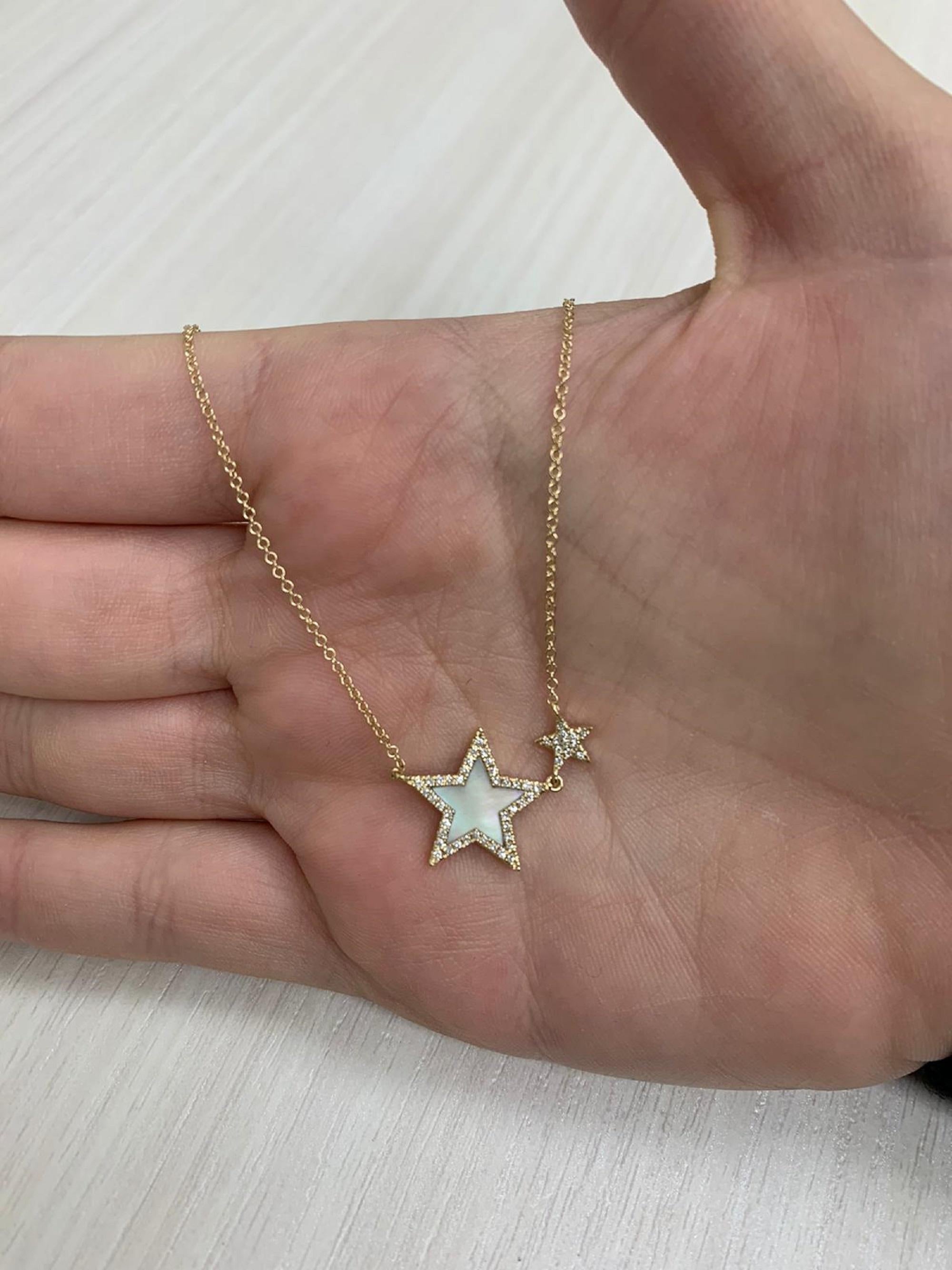 This Stunning and Elegant Star Necklace features 0.48 carats of Mother of Pearl and has 0.15 carats of natural round Diamonds hangs on an adjustable 16