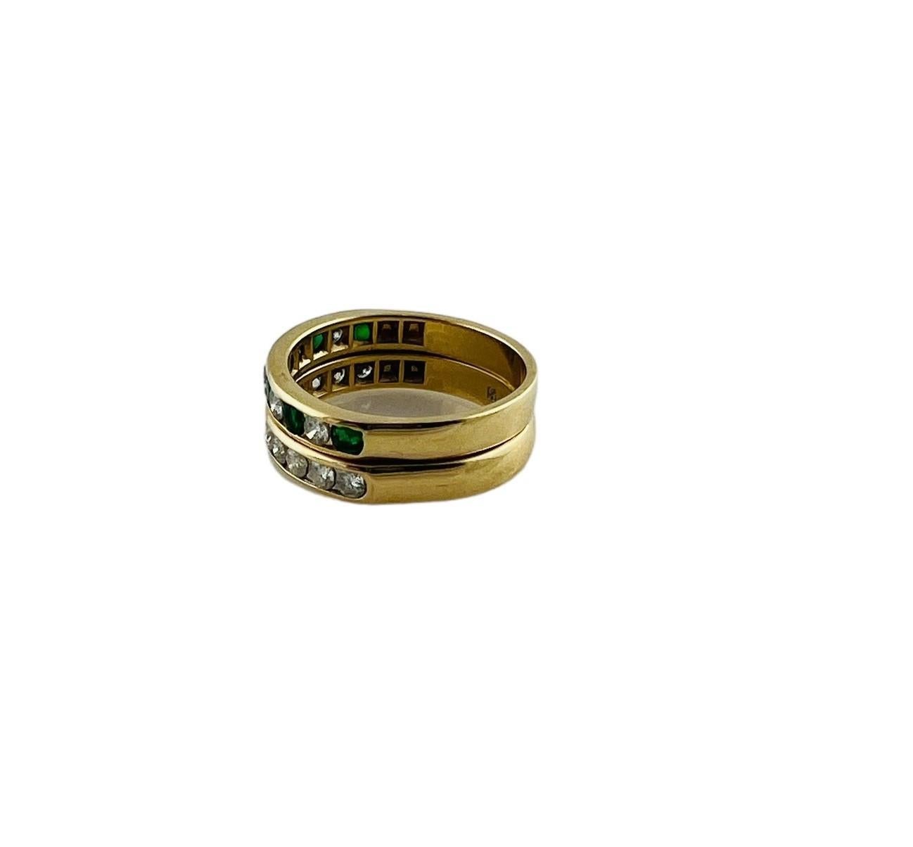 Vintage 14K Yellow Gold Diamond & Natural Emerald Double Band Ring Size 6.25

This beautiful piece features 2 bands that have been permanently smoldered together to create a gorgeous ring! The ring features 16 round brilliant cut diamonds and 6