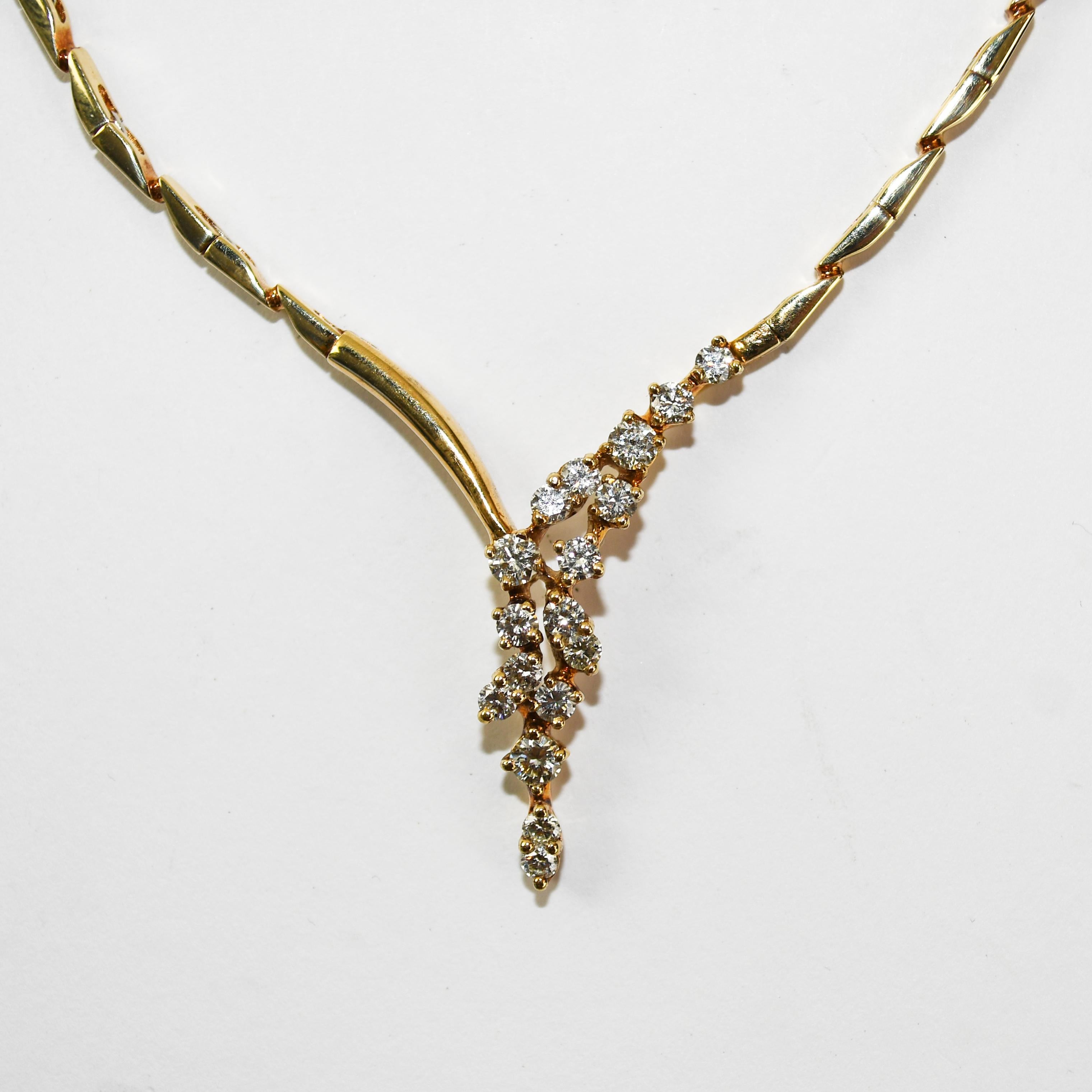 Ladies 14k yellow gold and diamond necklace.
Stamped 585 and weighs 22.4 grams.
The diamonds are round brilliant cuts, .75 total carats, H to I color, Vs clarity.
The necklace measures 18 inches long and 2mm thick.
Overall, excellent condition.