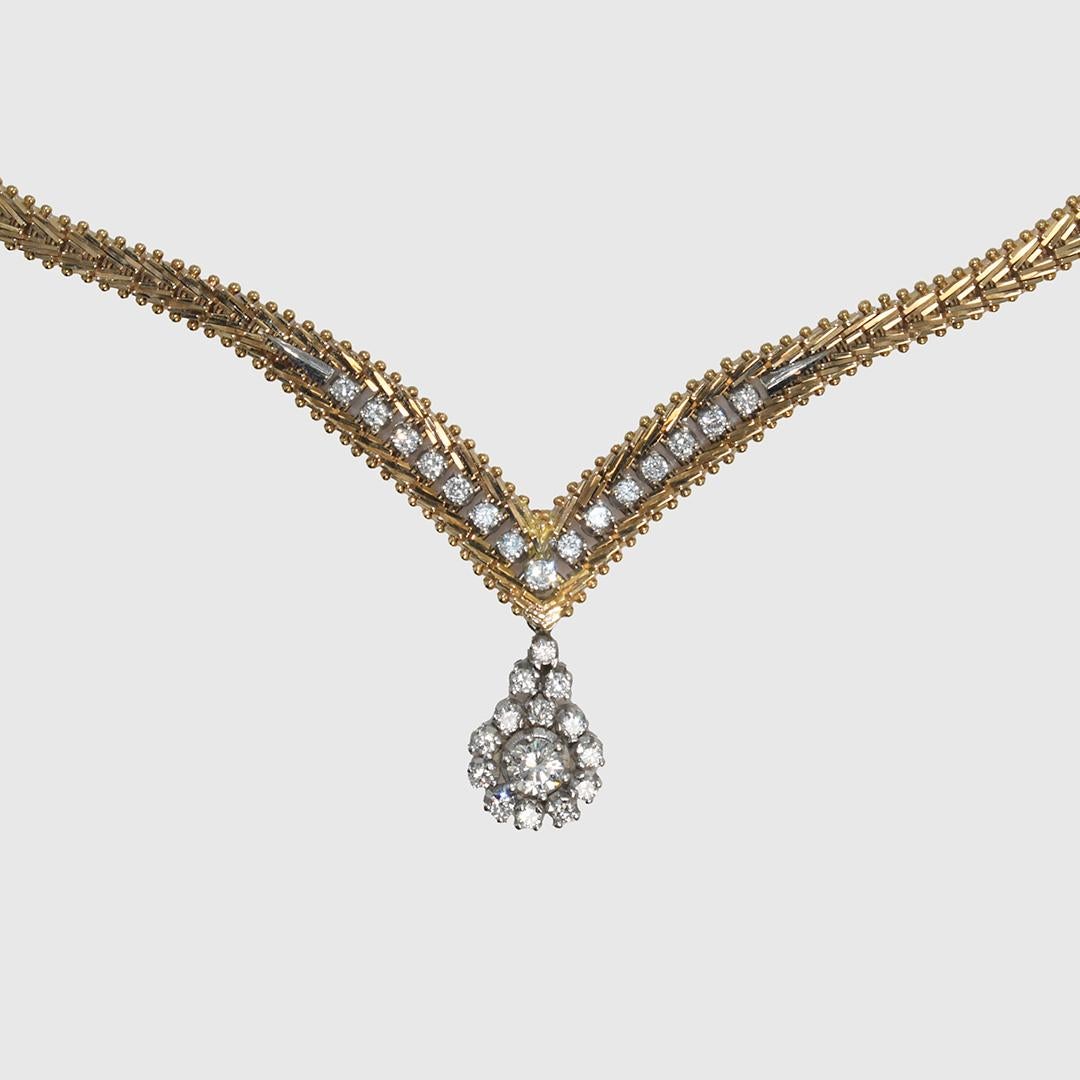 14k Yellow Gold Diamond Necklace with 1.25TDW.
There is .85ct of smaller .03ct Round Briliants, with one .40ct RBC in the center of the pendant.
Most of the stones are VS Clarity, G-H Color, and the larger center stone is SI2 Clarity.
Tests 14k and