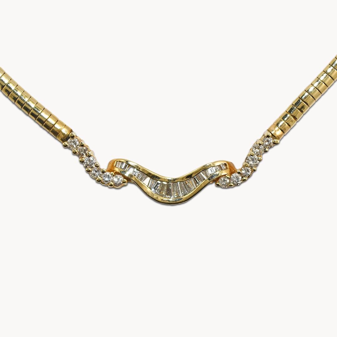Attractive diamond necklace in 14k yellow gold
Stamped 14k and weighs 27 grams
The diamonds are round brilliant cuts and baguette cuts, 2.00 total carats, H to I color, VS to Si clarity, good cuts.
The necklace measures 18 inches long(including the