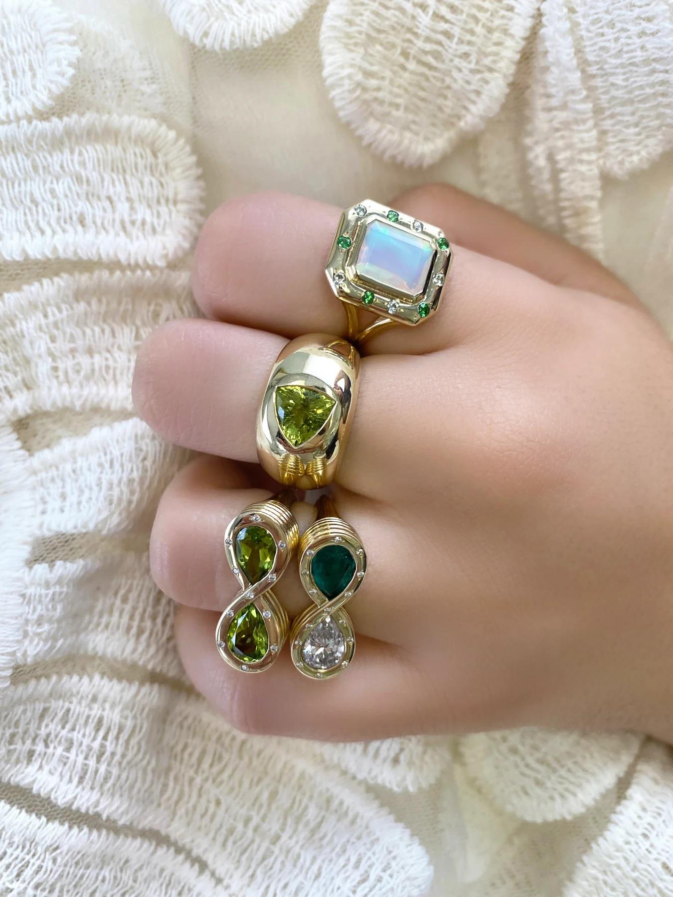 The ultimate everyday cocktails ring is found with this gorgeous Ethiopian Opal, Sapphire and Aquamarine ring. She boasts 2.45 carats of dazzling Opal and is constructed with our signature double shank to ensure a great fit. Gilded with a generous