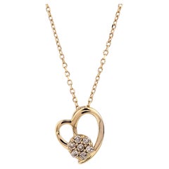 Collana con ciondolo a forma di cuore aperto con diamanti in oro giallo 14 carati