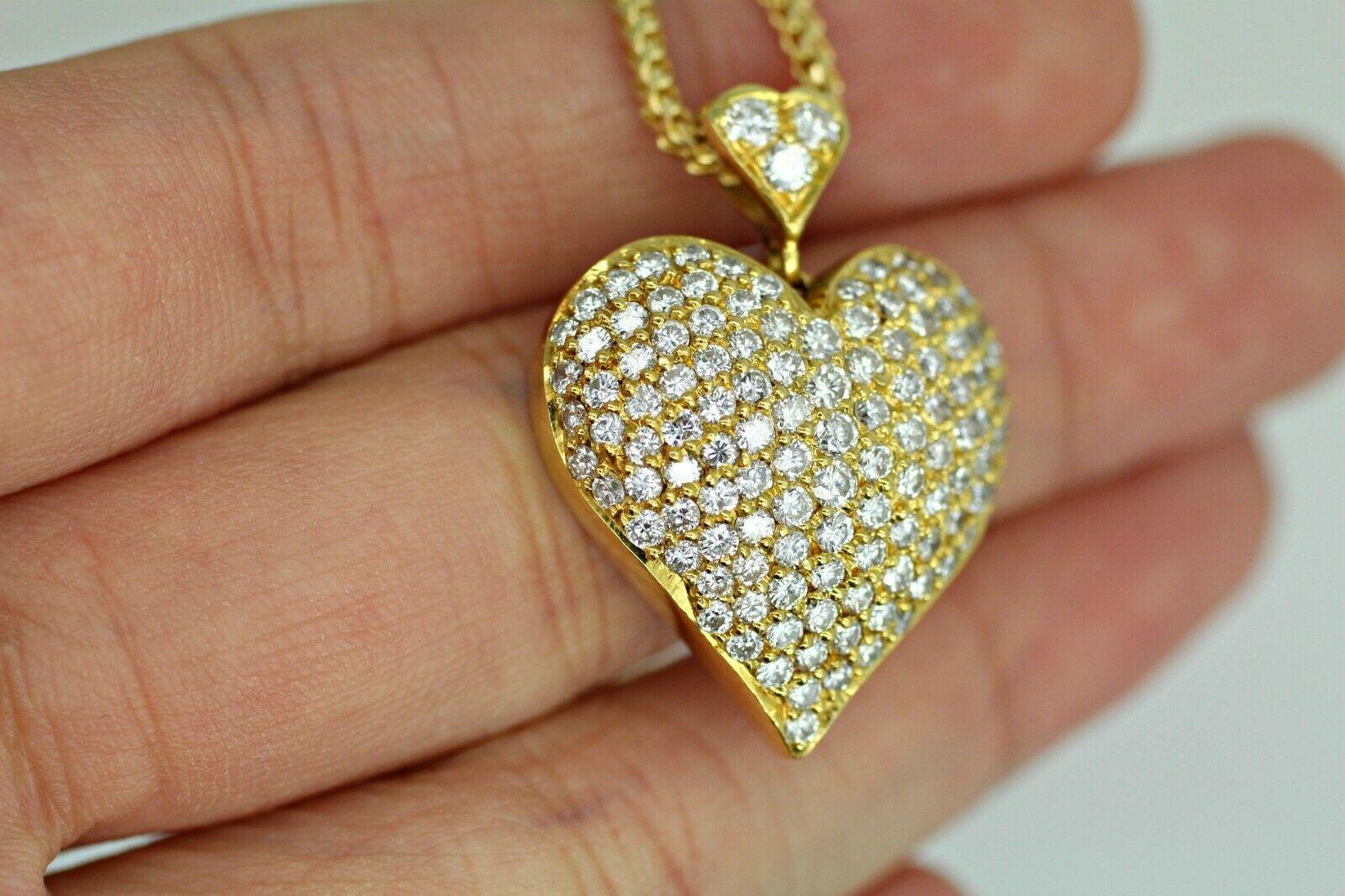  14k yellow gold diamond pave heart, containing 2.50ct.s color 