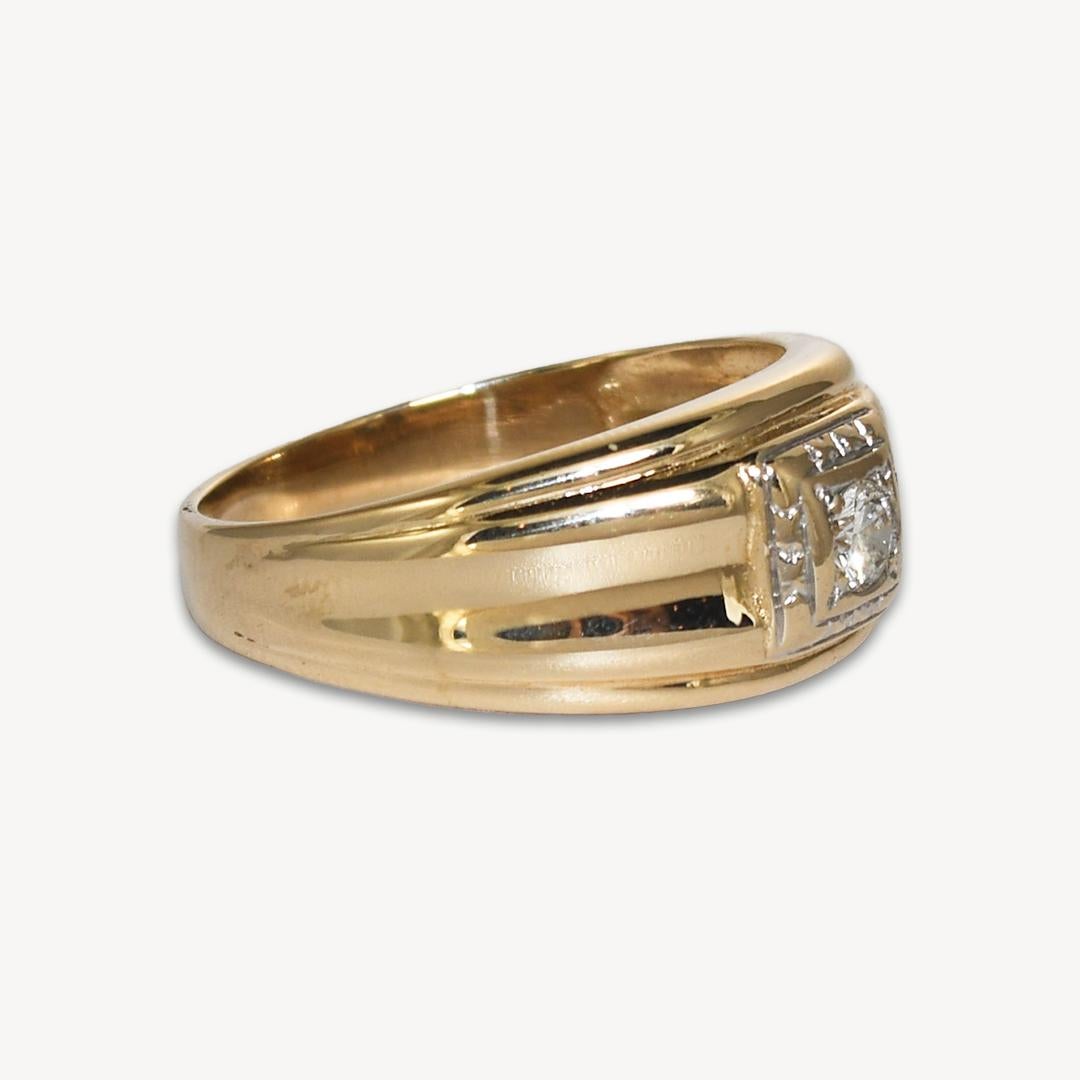 Attractive 14k yellow gold ring weighs 5.90 grams.
It contains a 3.8mm round brilliant cut diamond, .20 total carat weight.
The ring measures 0.3 inch in width.
The ring size is 11 and can be sized to fit.