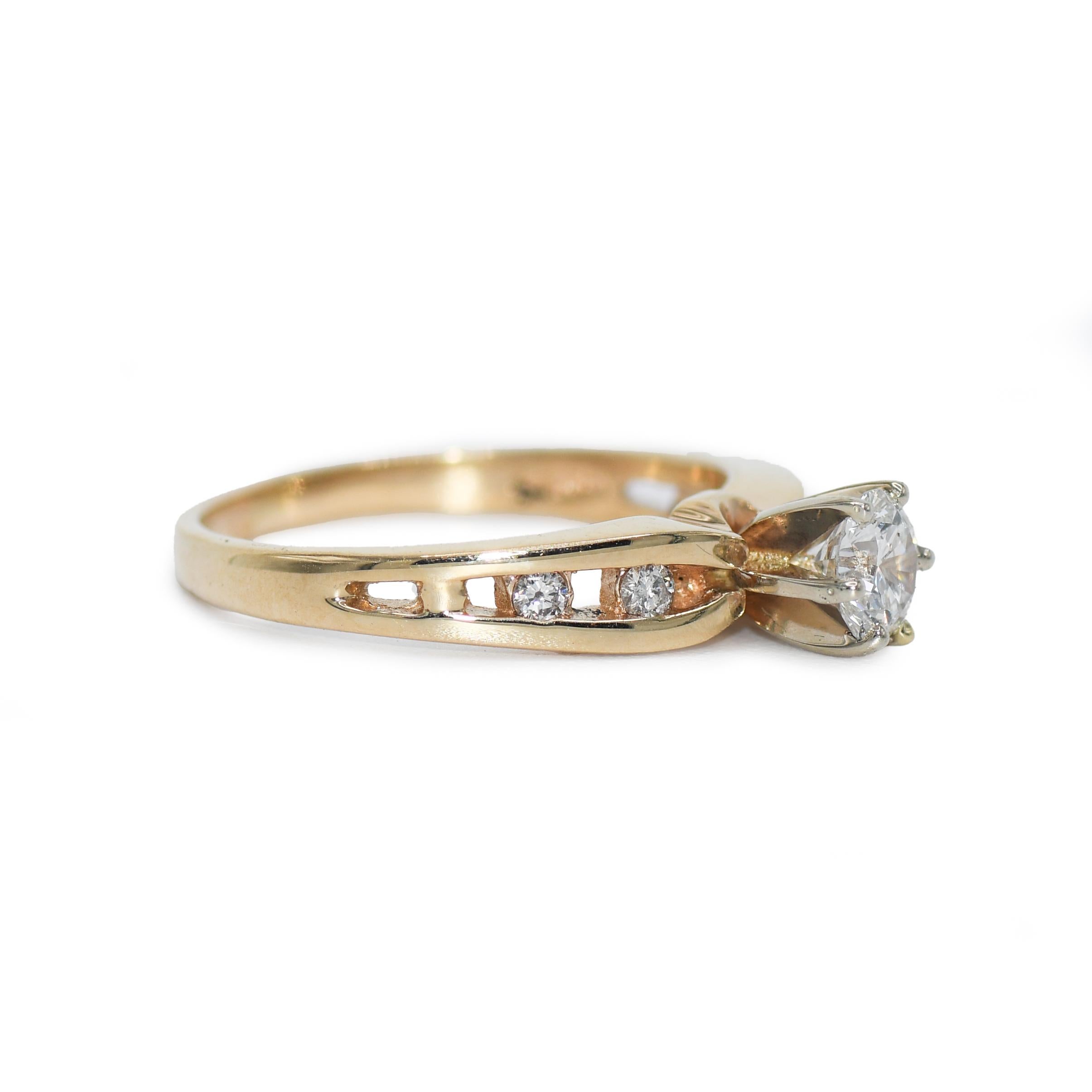14k yellow gold diamond ring.
The center stone is a round brilliant cut, .45ct, Clarity SI1, Color H-I. 
There are 4 smaller accent diamonds, .50tdw. 
Weighs 3.6gr, stamped 14k
size 7, can be sized up or down for an additional fee
Recently polished,