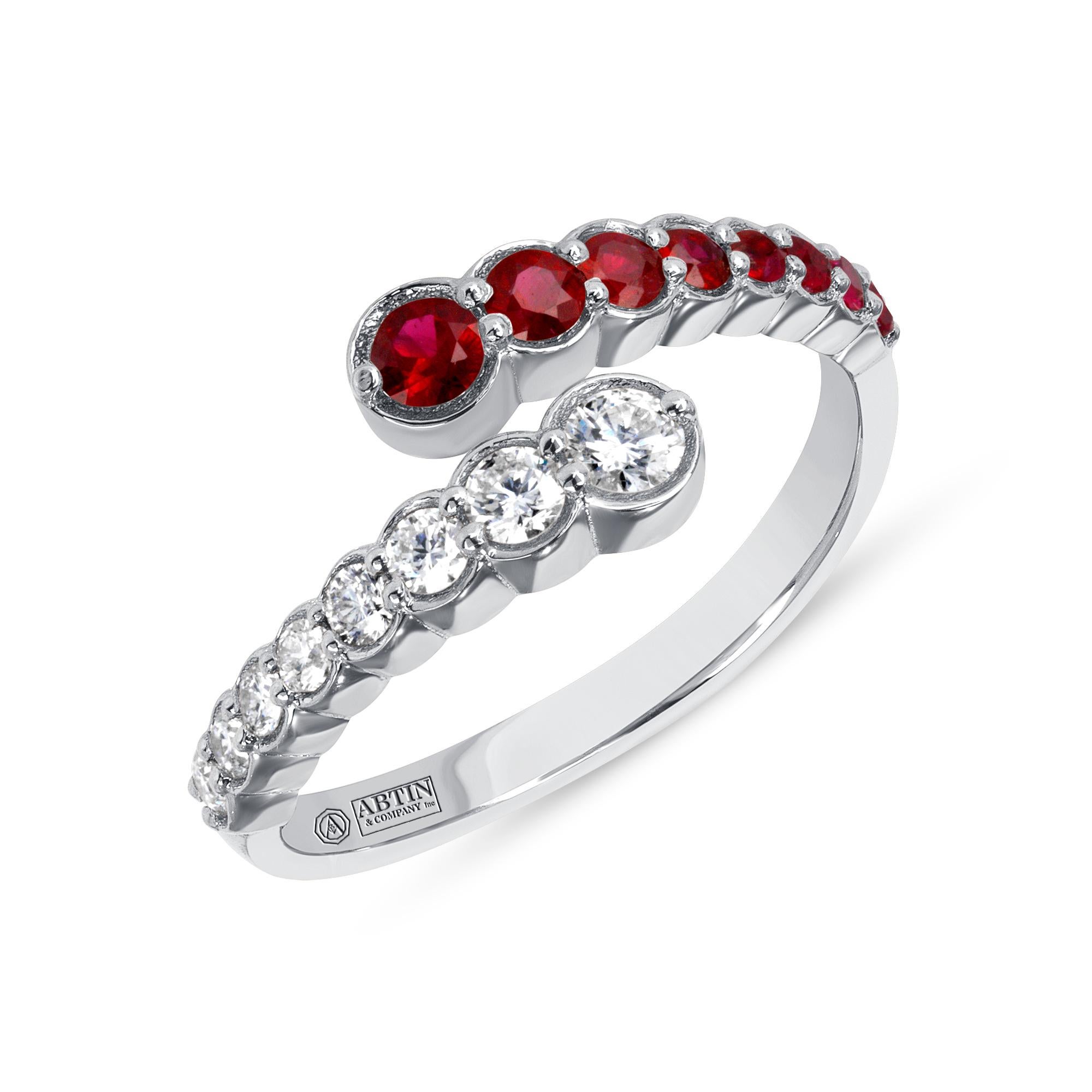 Crafted in 14K gold this ring features clean and contemporary lines. This modern and stylish open bypass ring is set with mesmerizing round-cut 
diamonds and genuine ruby. Stack it with your stacking rings or wear it solo to elevate any look.

Gold
