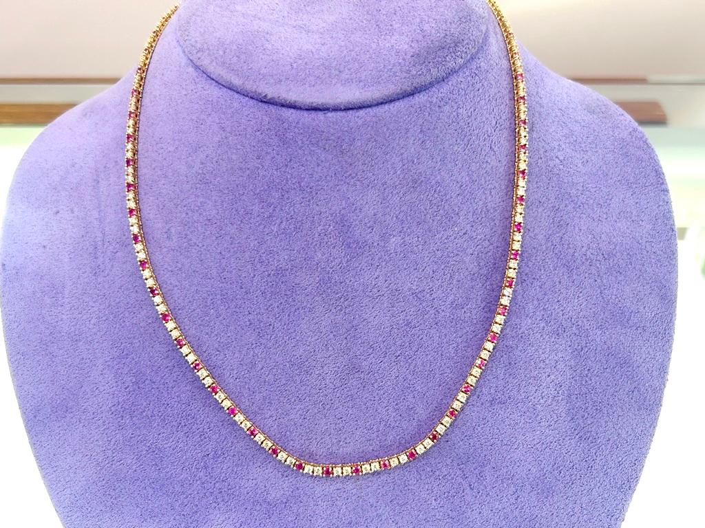 Elevate your elegance with this exquisite ruby and diamond tennis necklace designed to captivate with its brilliance. This necklace offers versatility and enduring beauty, making it a perfect statement piece for any jewelry collection whether worn