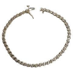 14k Yellow Gold Diamond S Style Tennis Bracelet Weighing .75ctw 14k Yellow Gold Diamond S Style Tennis Bracelet Weighing .75ctw