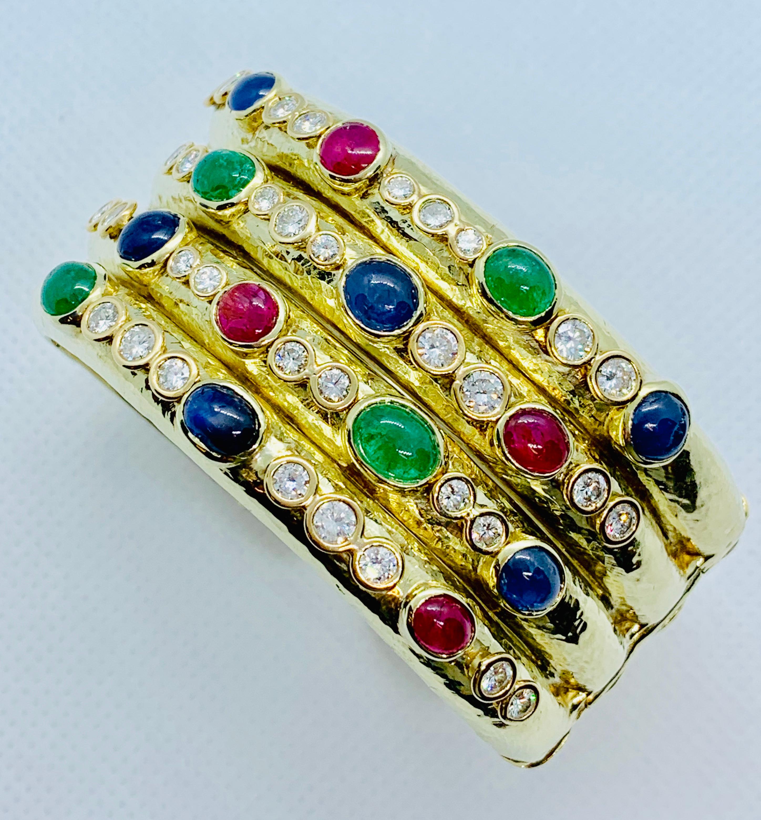 This bracelet is absolutely stunning! This is a double hinged, 30mm Wide Cuff. This piece has unmatched craftsmanship. It has no hallmarks but has been acid tested as 14K Yellow Gold. We believe this was originally a privately commissioned piece.
