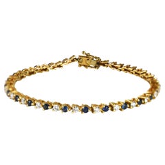 Bracelet de tennis en or jaune 14K avec diamants et saphirs 9.6g